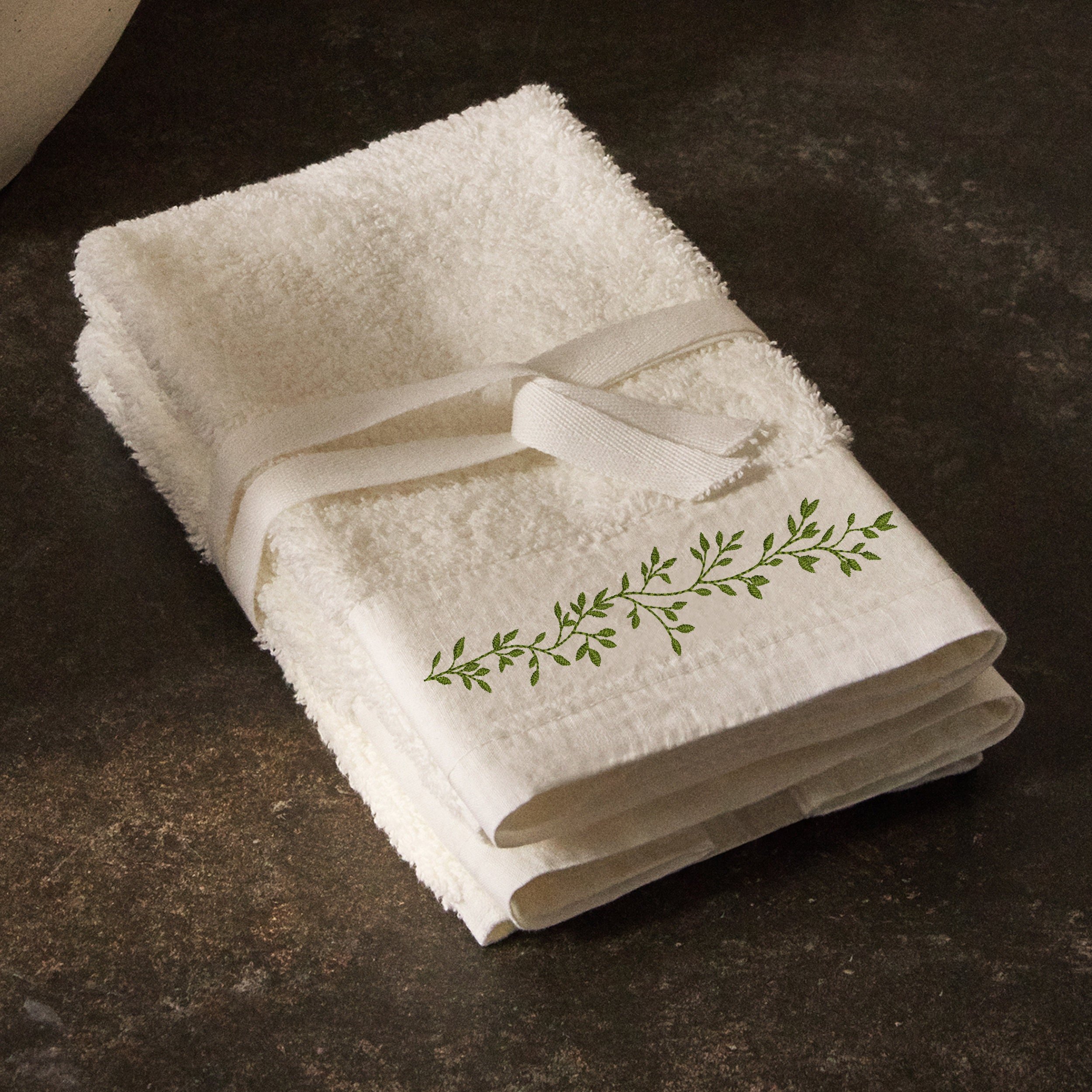 Rich Greenery Wreath and Border Machine Embroidery Design embroidered on a bathroom towel