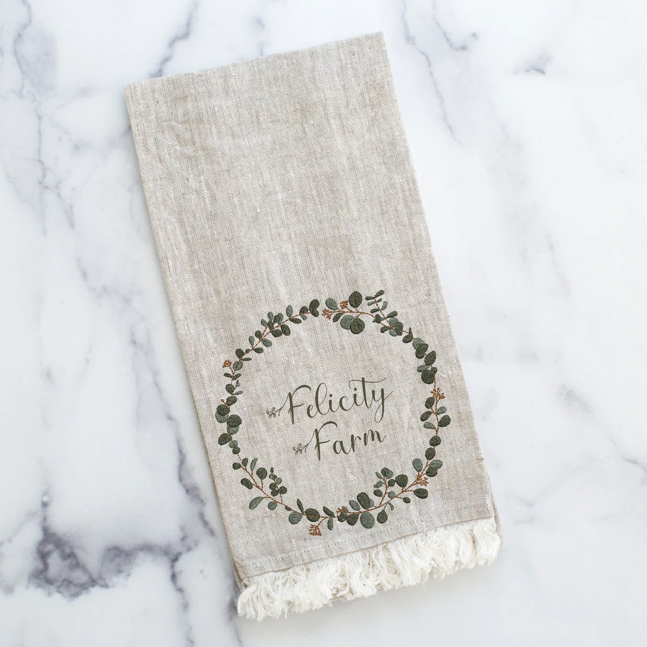 Modern Eucalyptus Wreath and Border Machine Embroidery Design Bundle embroidered on a towel