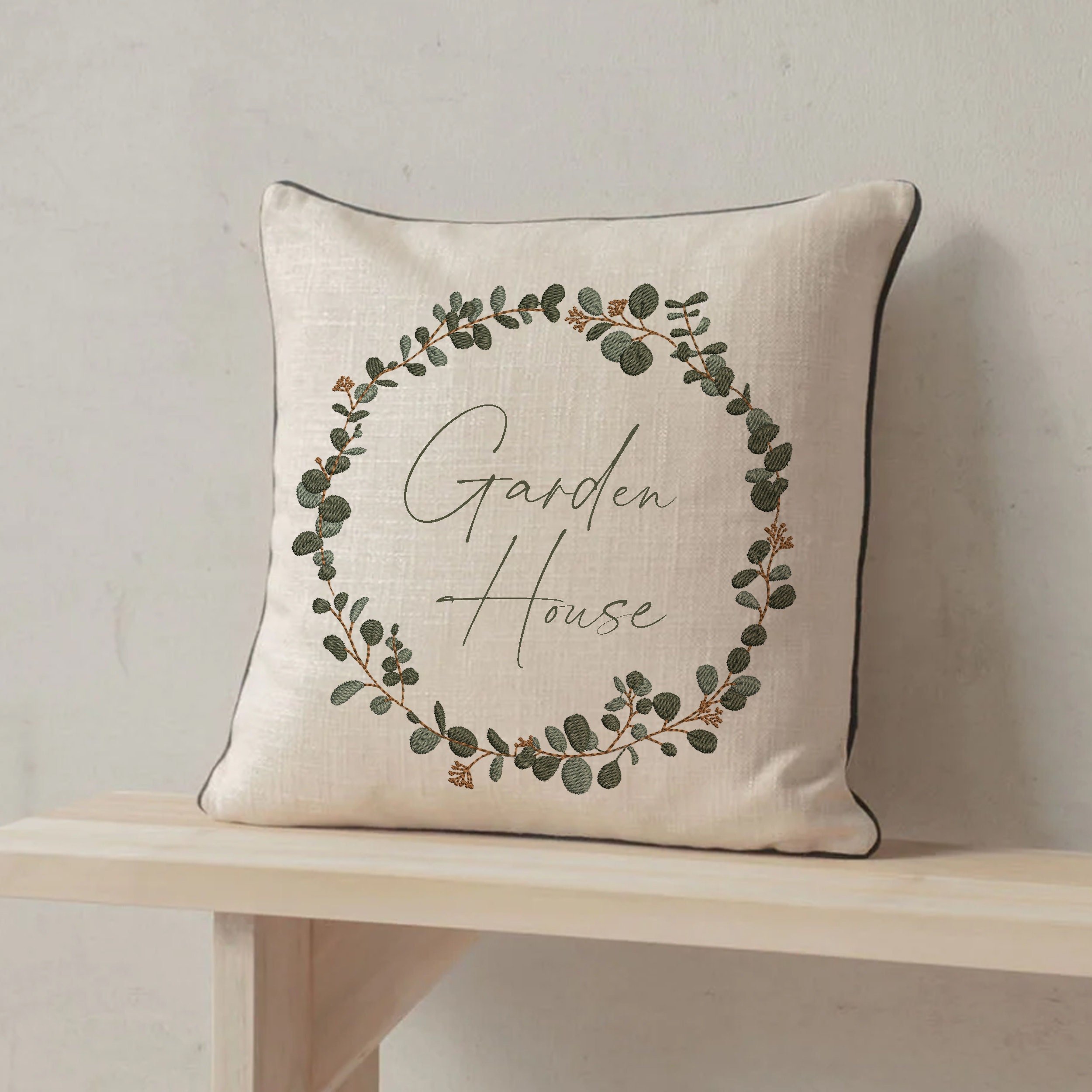 Modern Eucalyptus Wreath and Border Machine Embroidery Design Bundle embroidered on a pillow