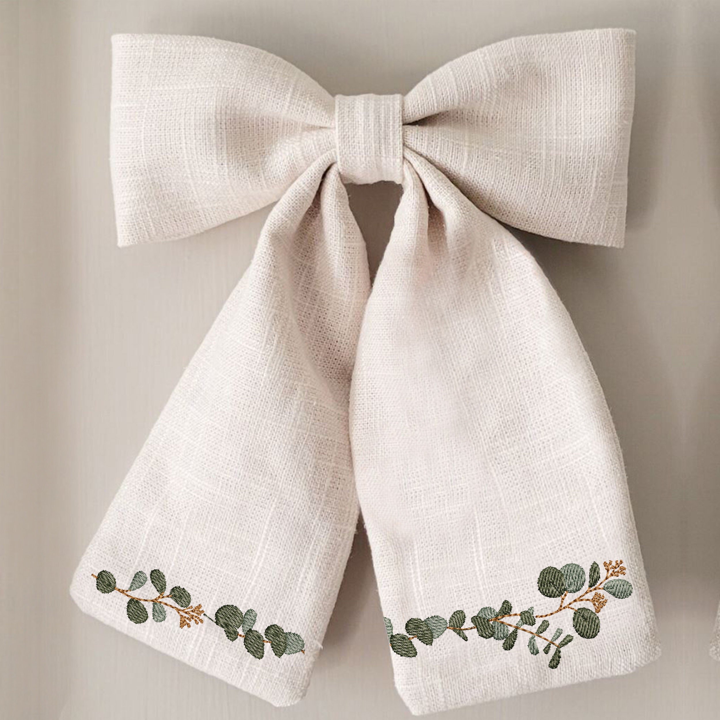 Modern Eucalyptus Wreath and Border Machine Embroidery Design Bundle embroidered on a bow