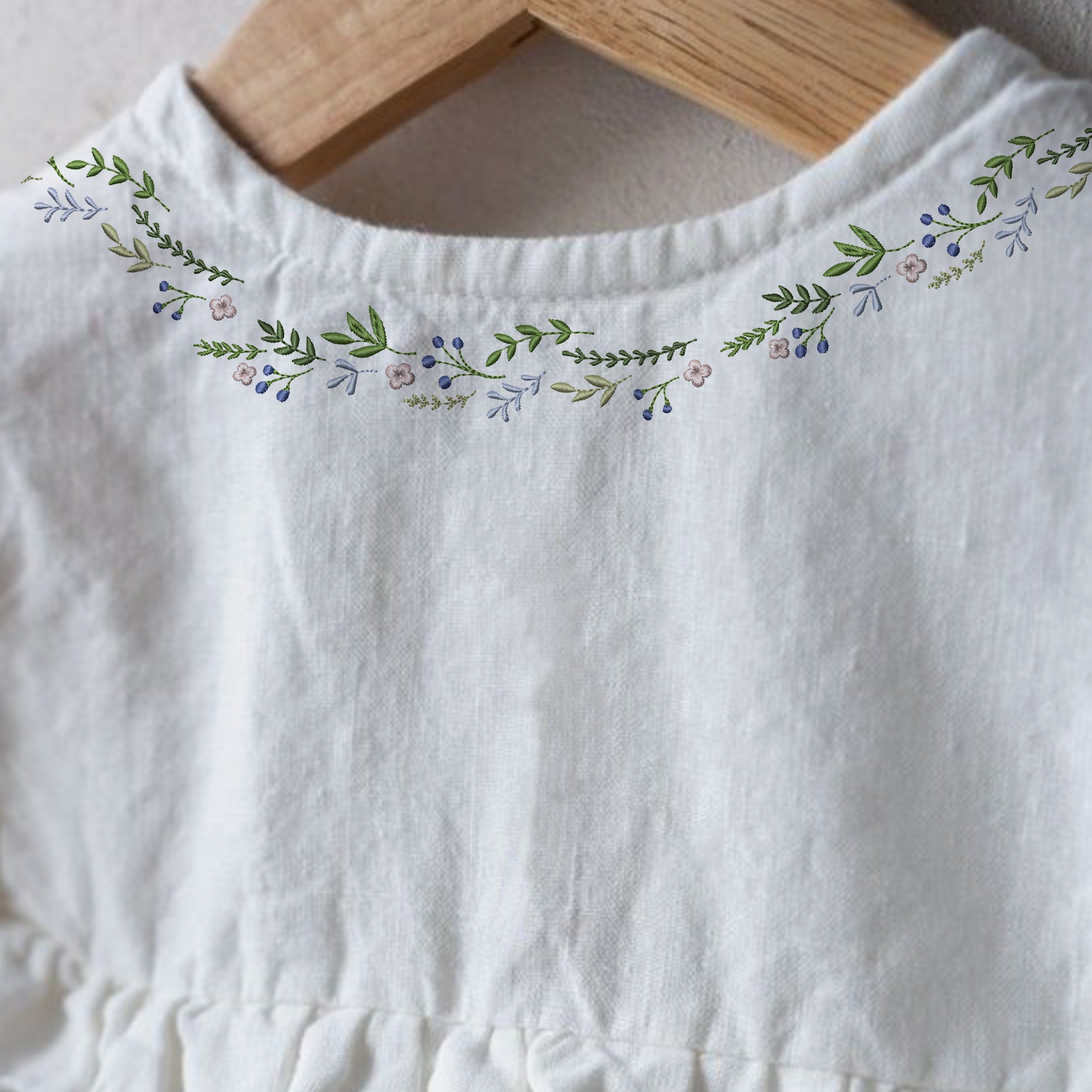 Beauty Wreath and Border Machine Embroidery Design embroidered on a blouse