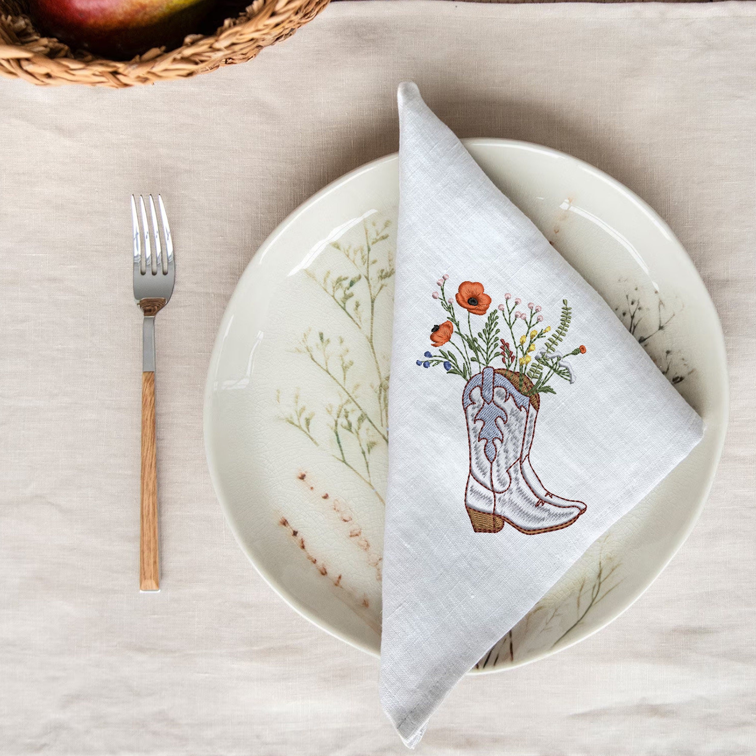 Cowgirl Wildflower Boots Machine Embroidery Design embroidered on a linen napkin