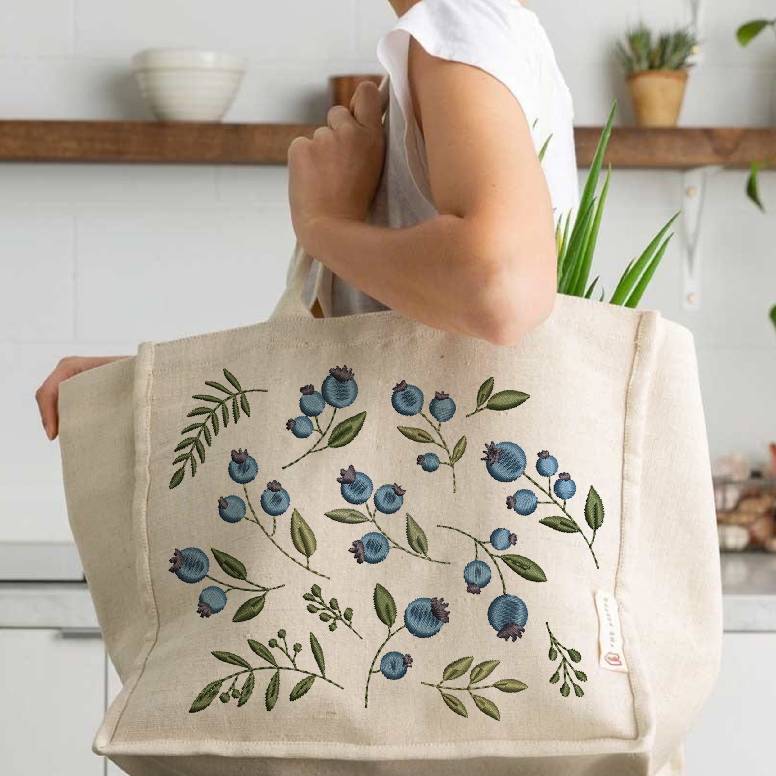 16 Blueberry Branches Machine Embroidery Design File embroidered on a handbag