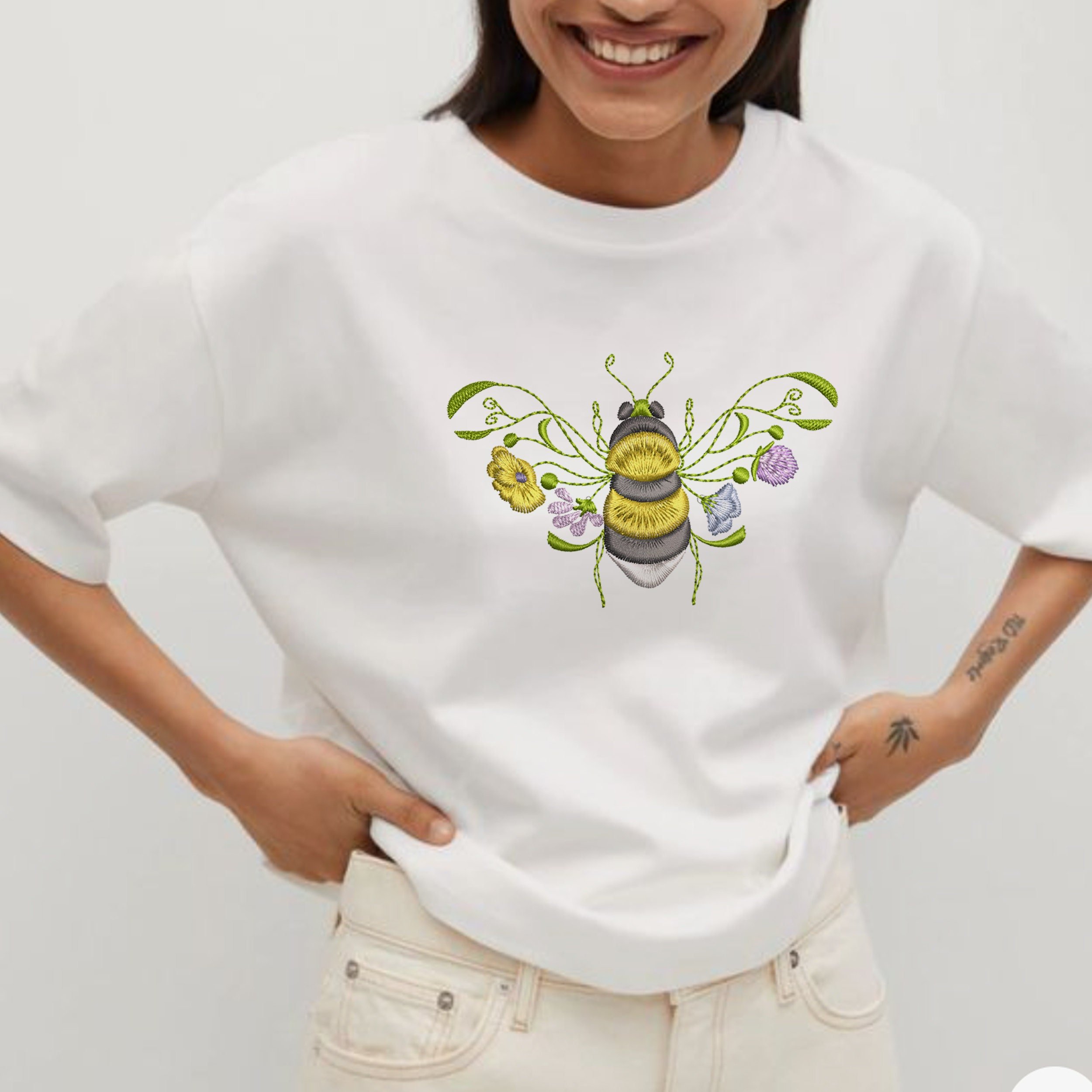 Garden Flower Bee Machine Embroidery Design embroidered on a cotton t-shirt