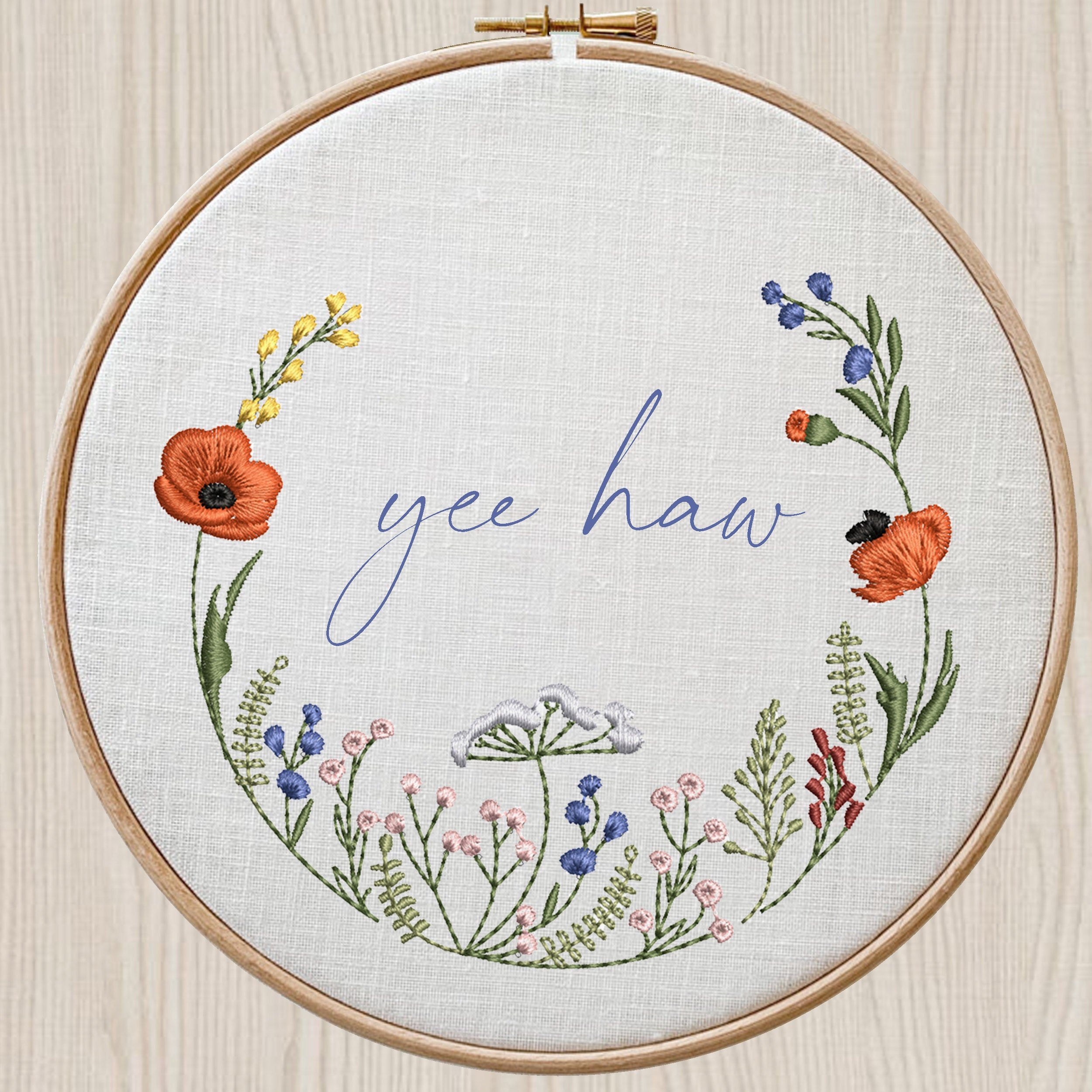 Cowgirl Poppy Wildflower Meadow Wreath and Border Machine Embroidery Design embroidered on a hoop