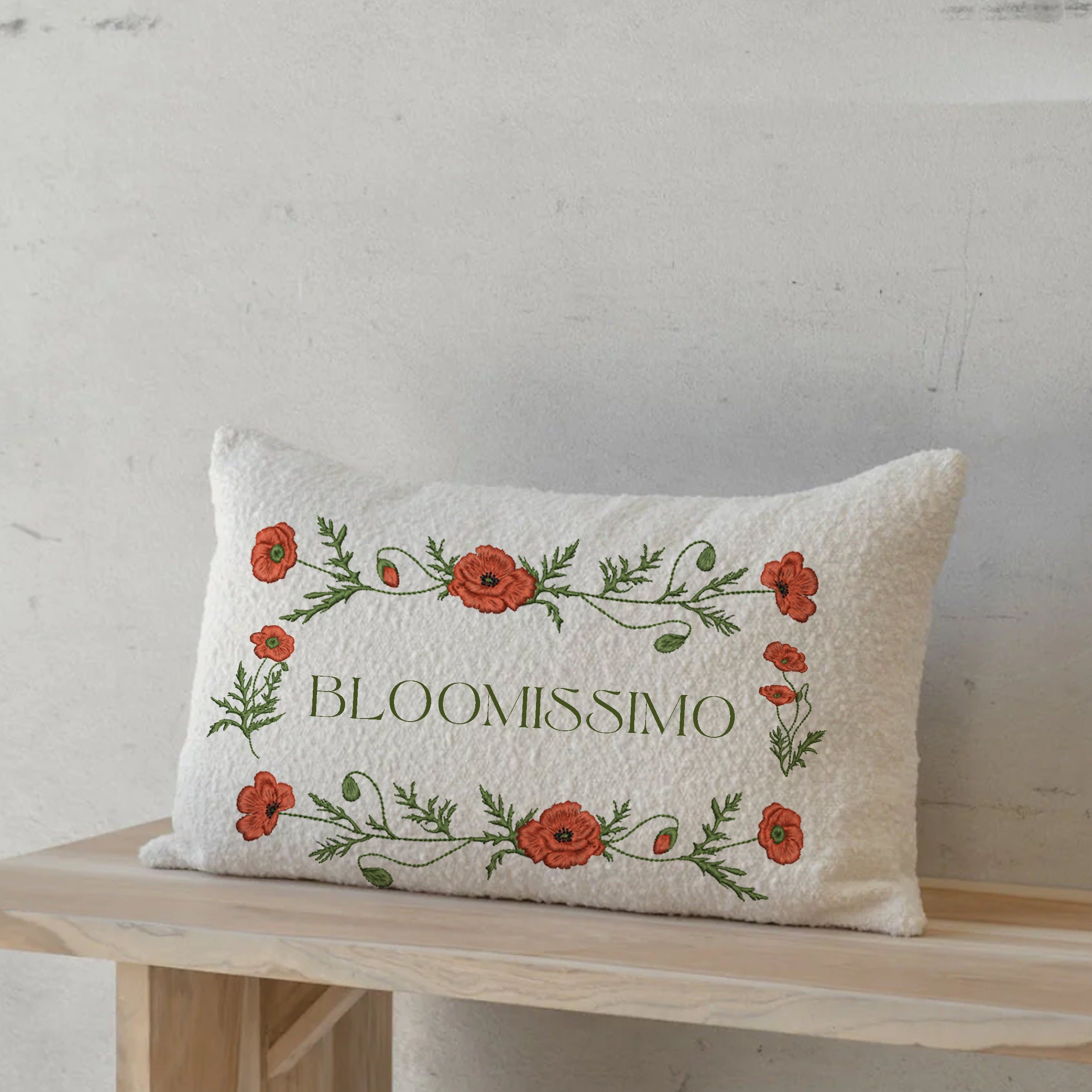 Bloomissimo Poppy Wildflower Wreath and Border Machine Embroidery Design embroidered on a rectangular pillow