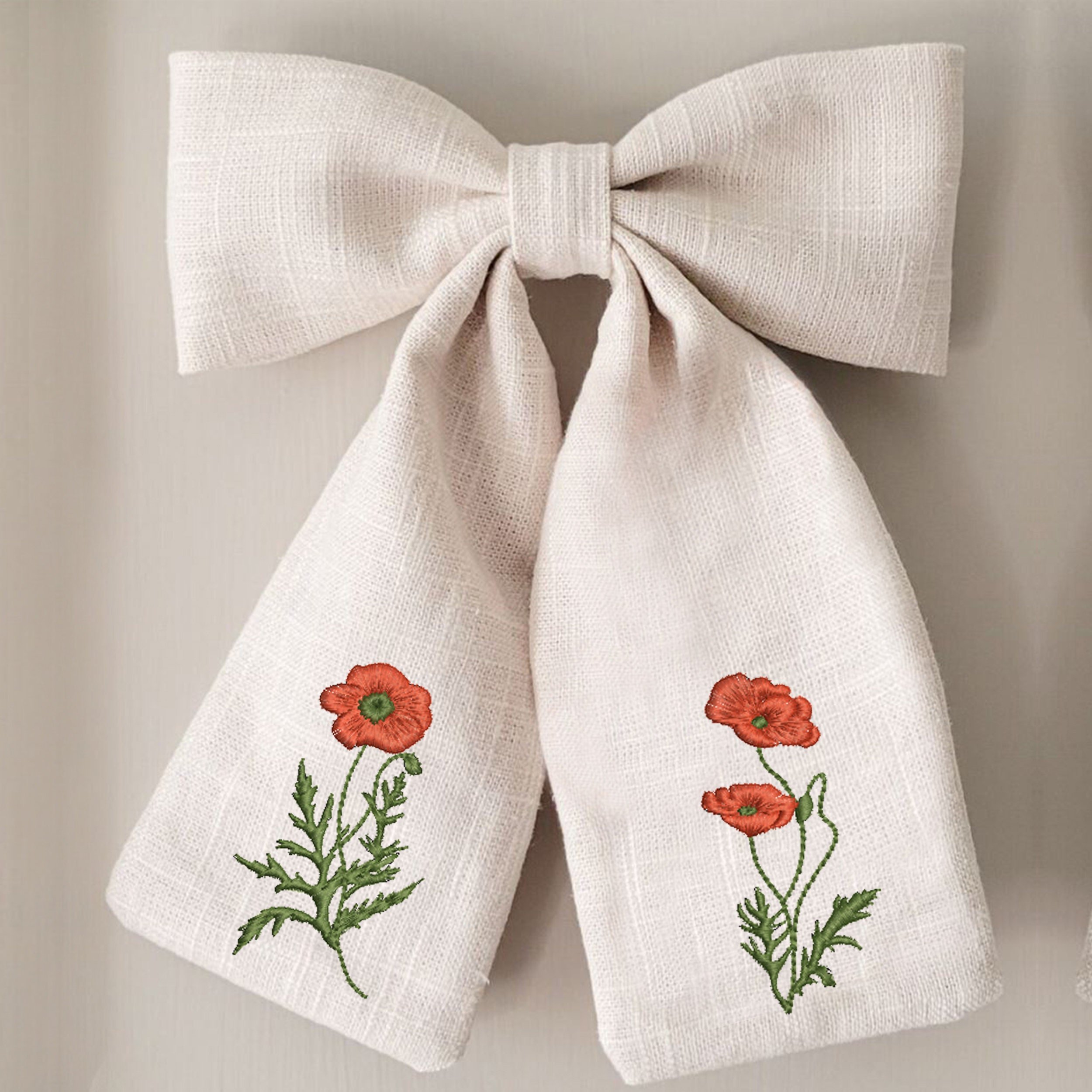 Bloomissimo Poppy Wildflower Wreath and Border Machine Embroidery Design embroidered on a bow