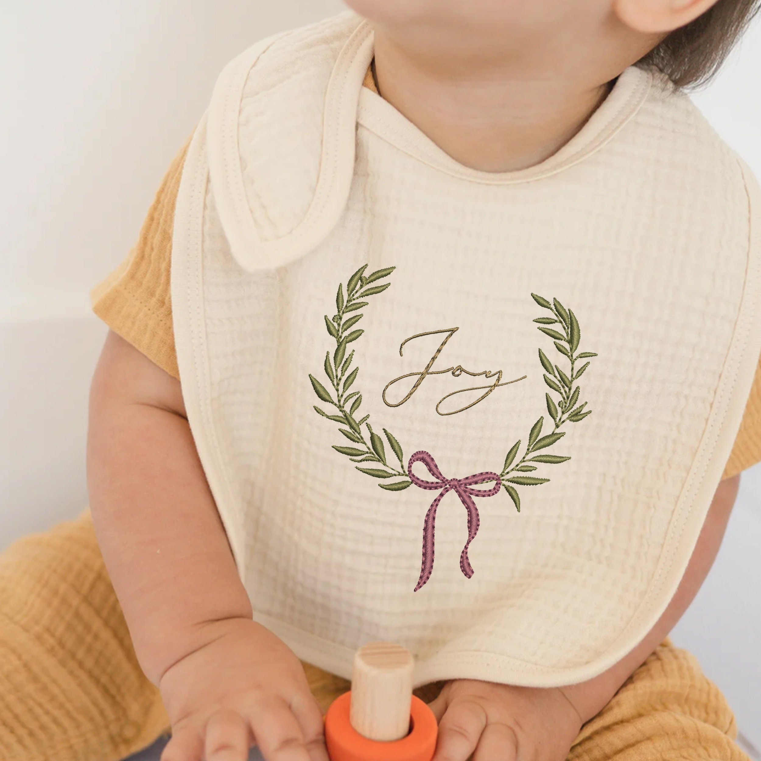 Amazing Bow Collection Machine Embroidery Design embroidered on a bib