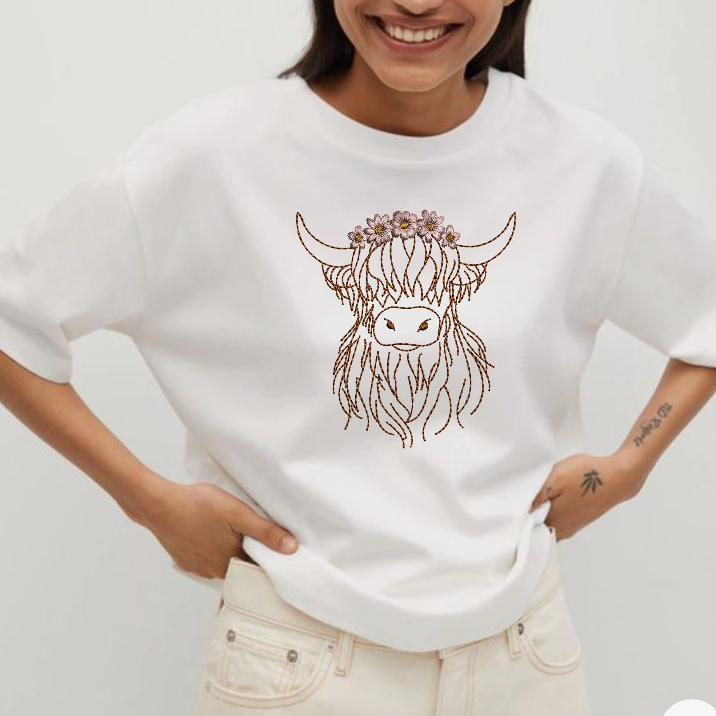 Highland Scottish Cow Machine Embroidery Design File embroidered on a white t-shirt