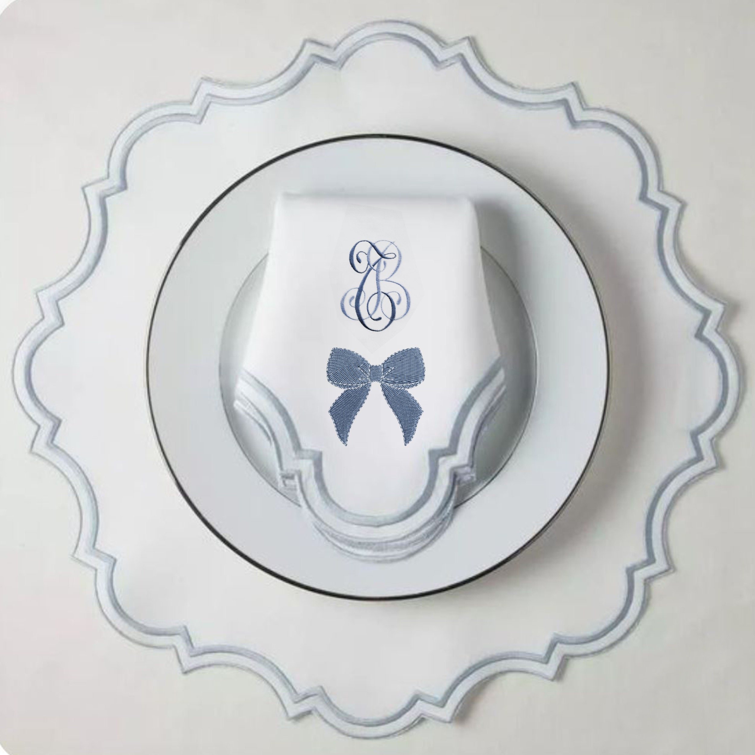 Chinoiserie Blue and White Bow Collection Machine Embroidery Design embroidered on a fancy napkin