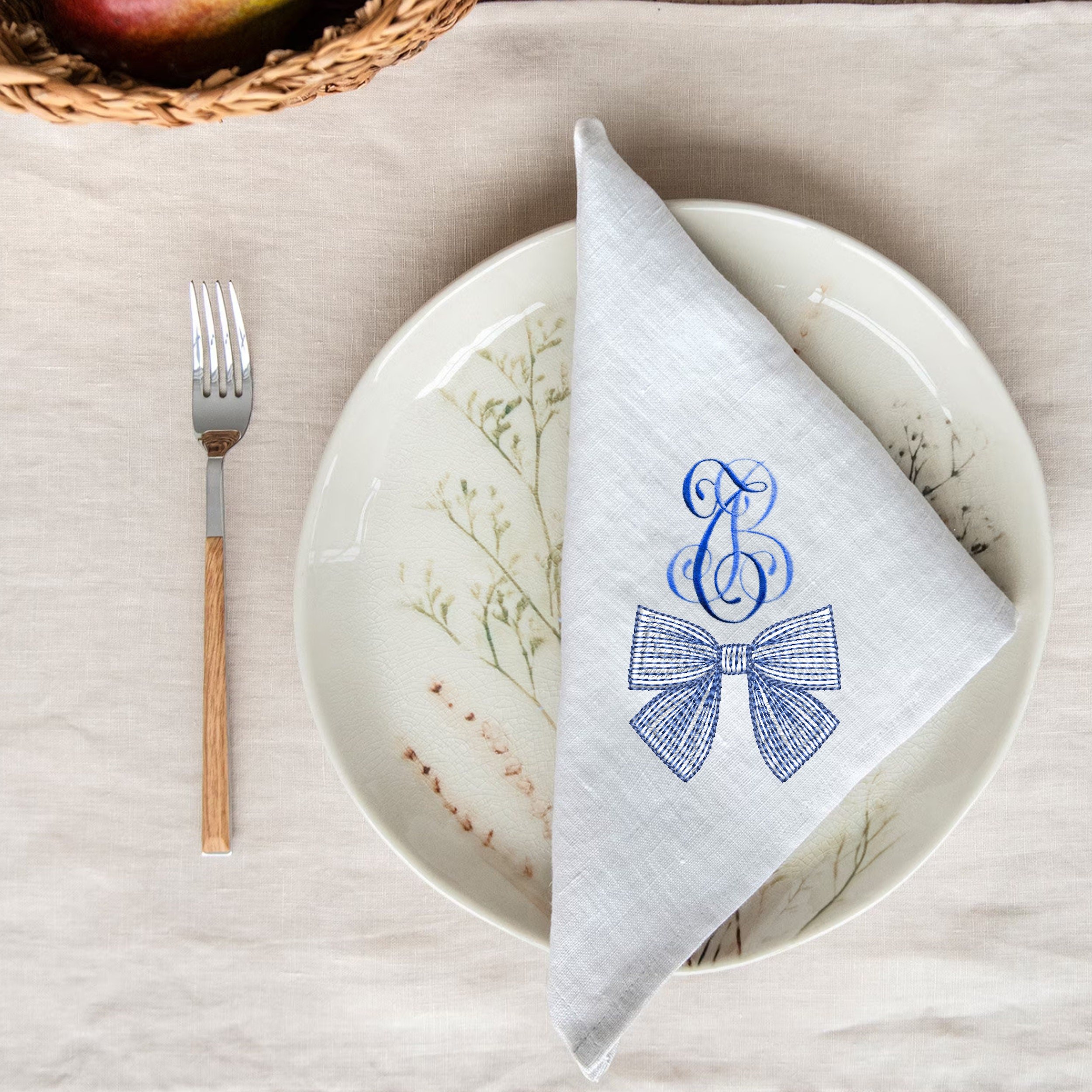 Chinoiserie Blue and White Bow Collection Machine Embroidery Design embroidered on a monogram napkin