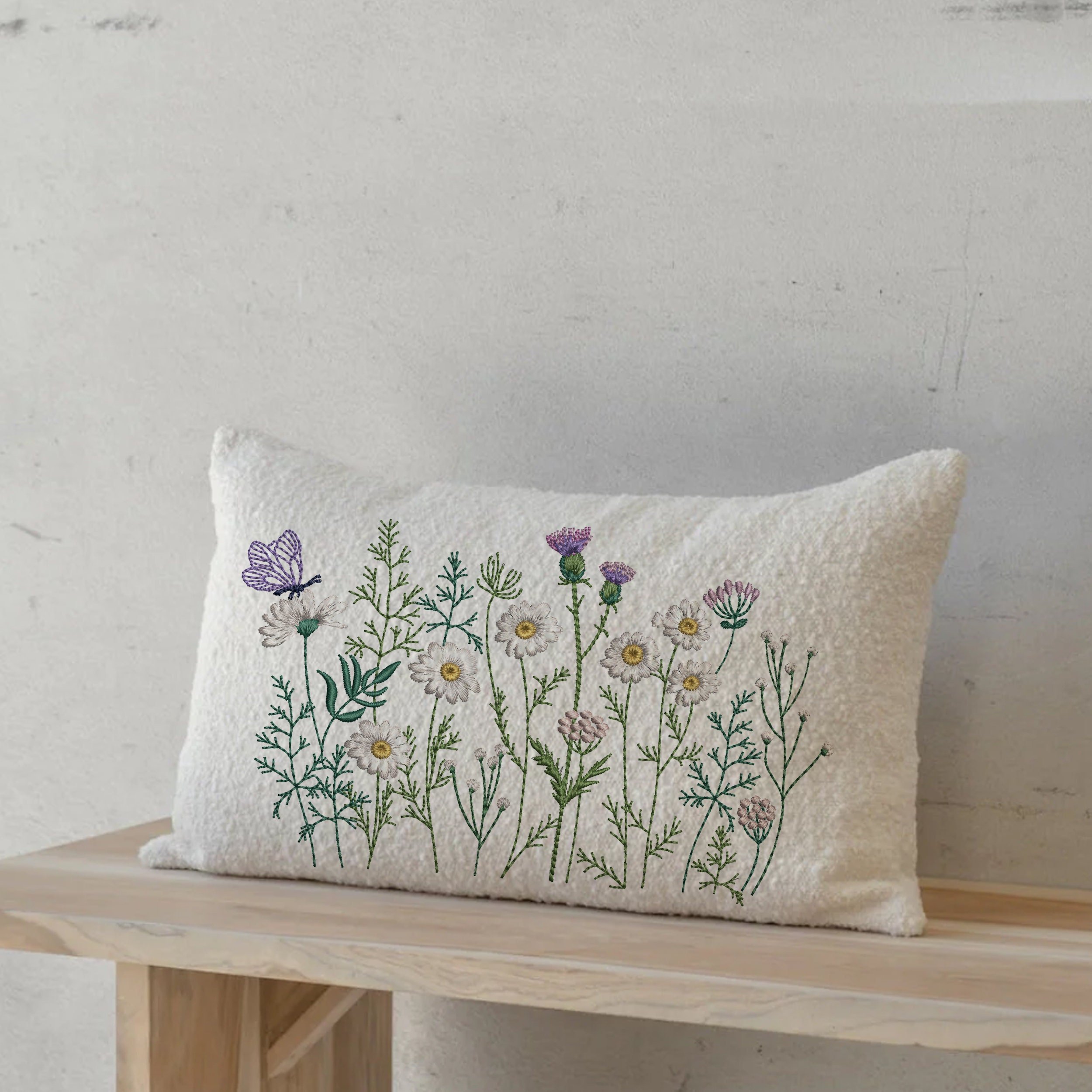 Butterfly Flower Meadow Machine Embroidery Design File embroidered on a rectangular pillow