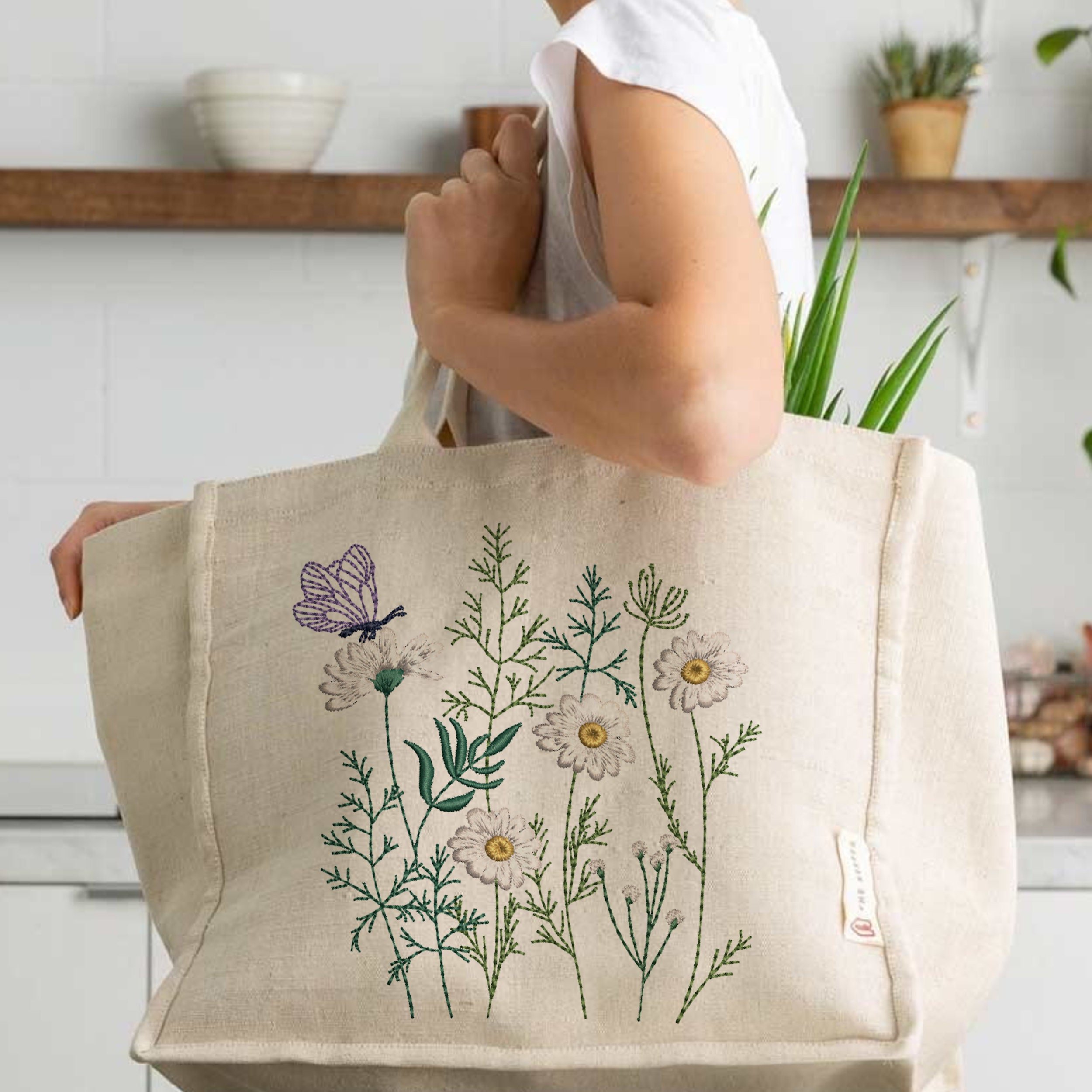 Butterfly Flower Meadow Machine Embroidery Design File embroidered on a handbag