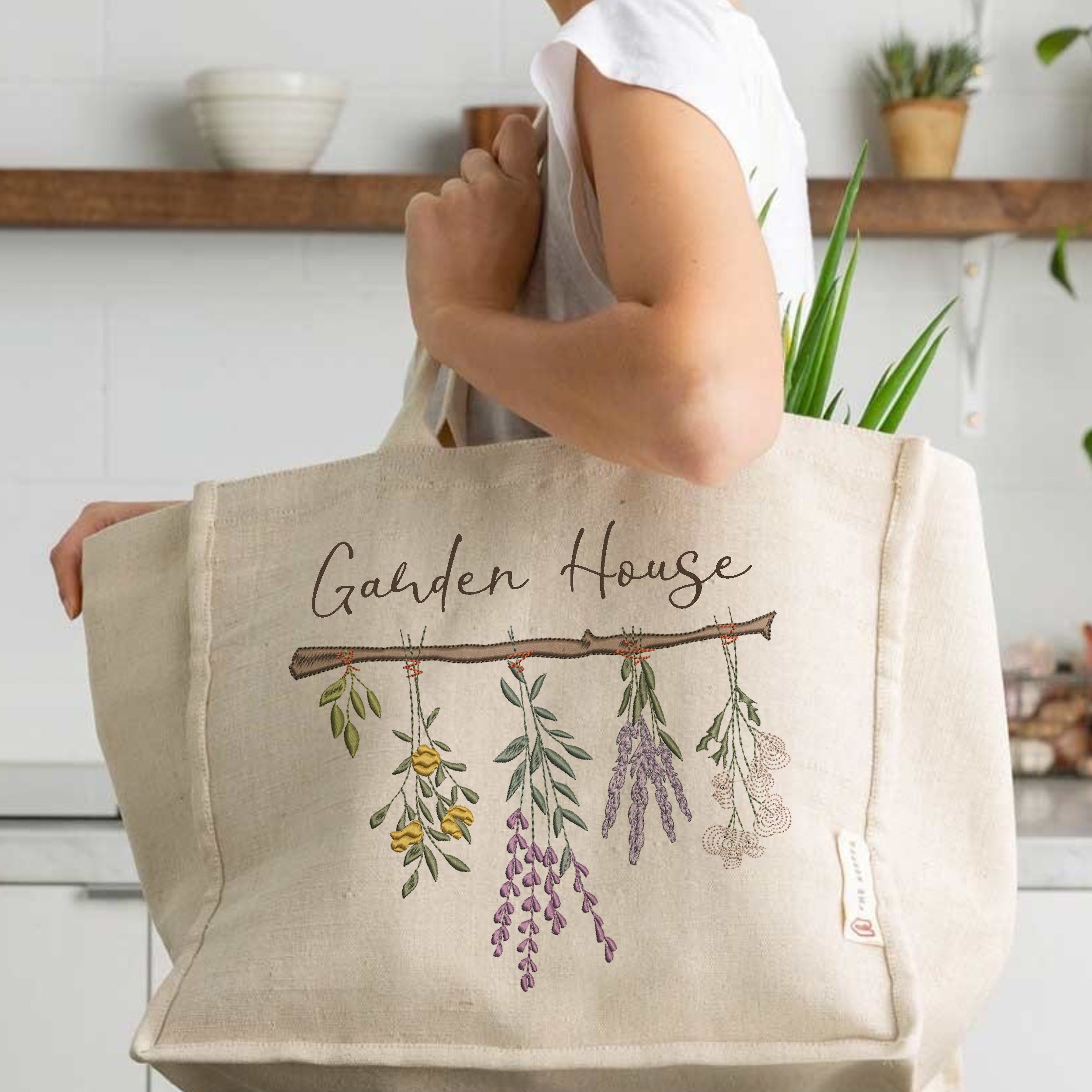 ing Herb and Wildflower Border Machine Embroidery Design File embroidered on a handbag