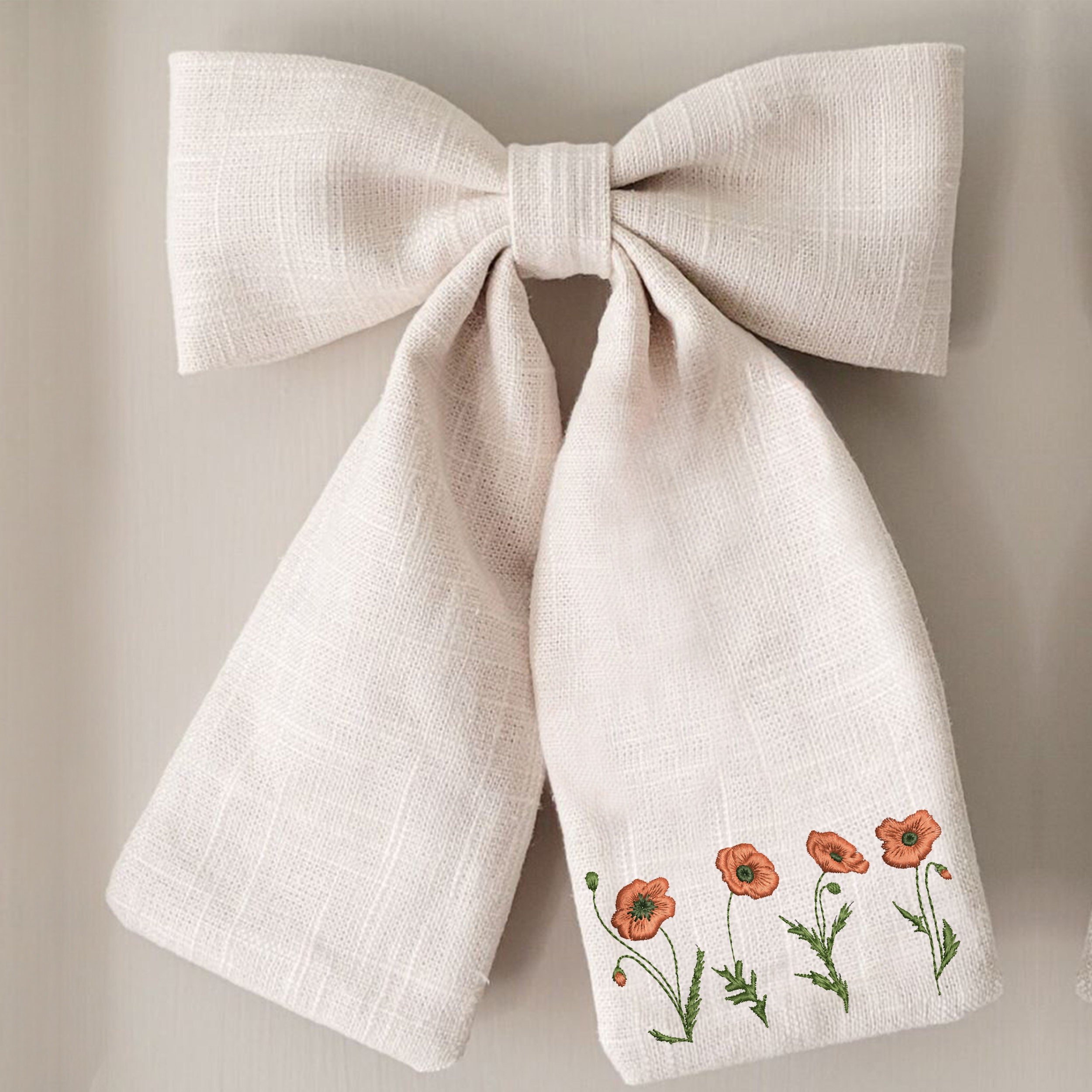 10 Poppy Flowers Machine Embroidery Design embroidered on a bow