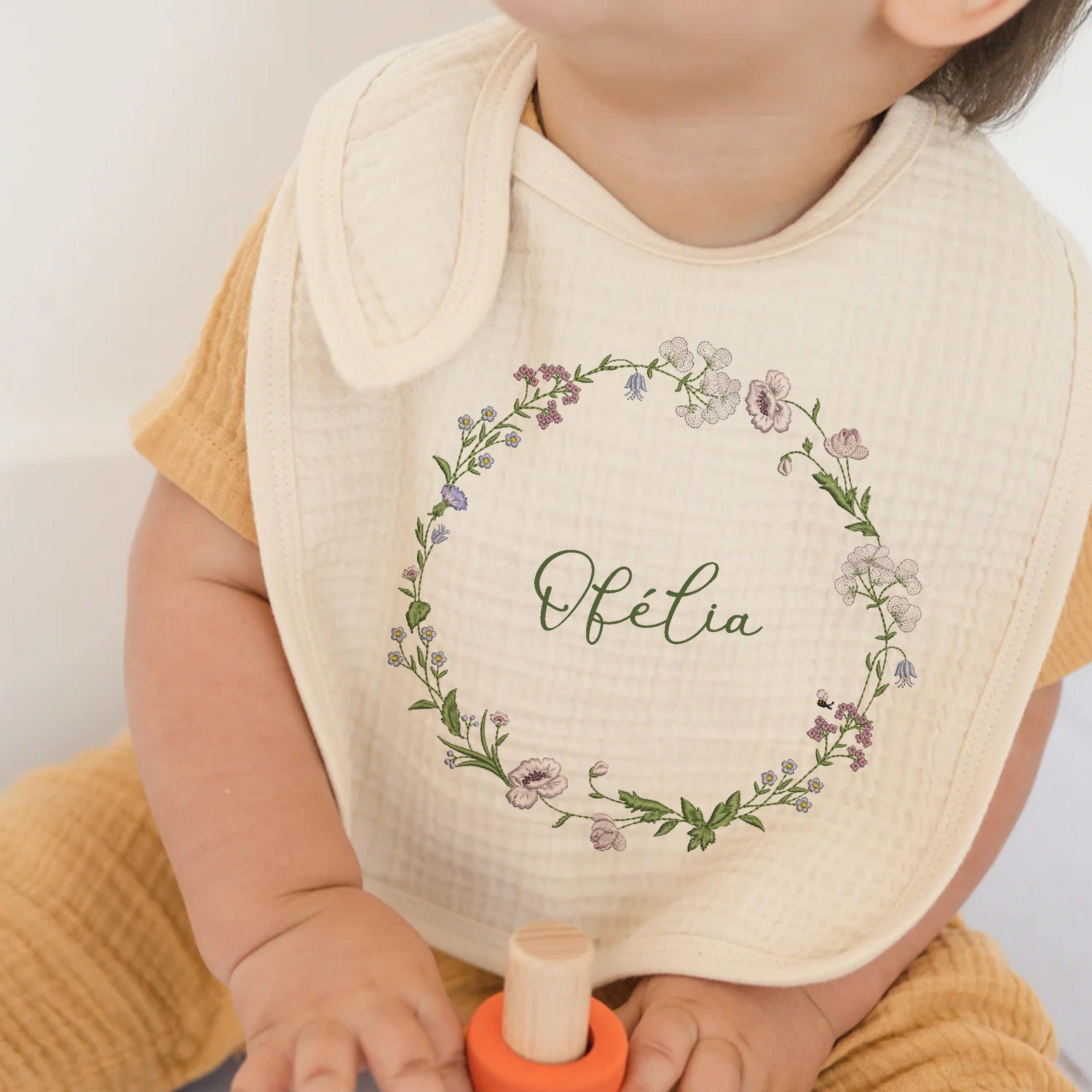 Fantastic Garden Wreath Border Corner Machine Embroidery Design embroidered on a bib
