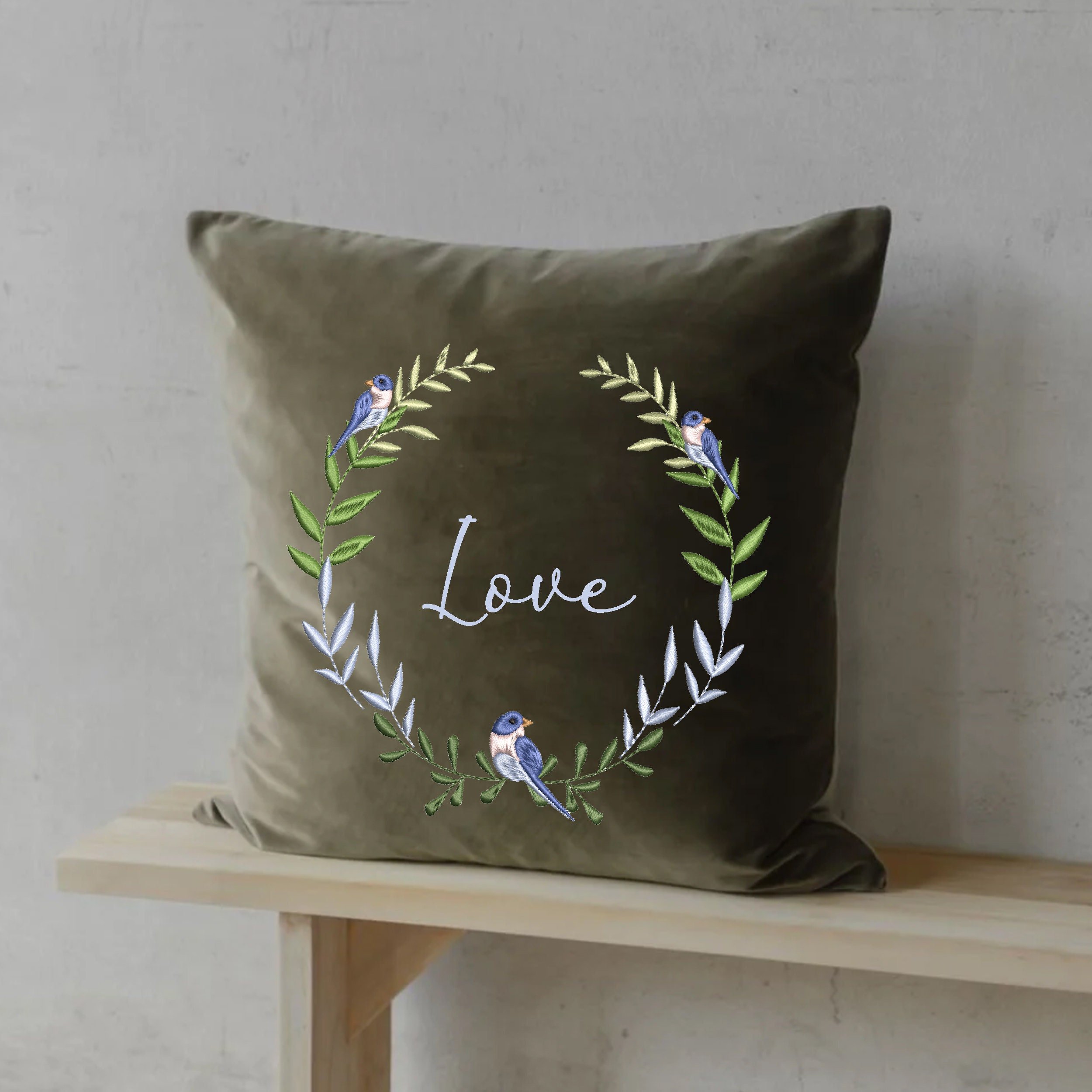 Bird Wreath and Border Machine Embroidery Design embroidered on a pillow