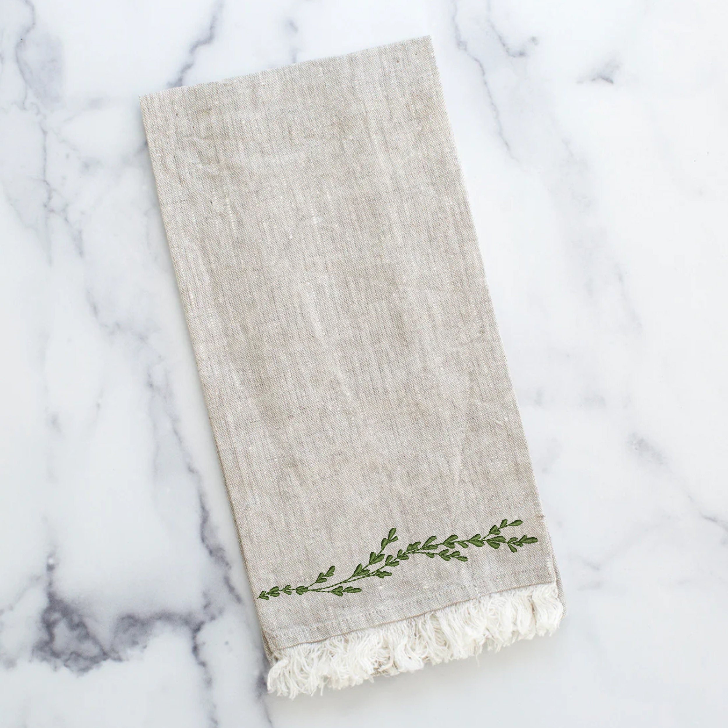 Delicate Greenery Wreath and Border Machine Embroidery Design embroidered on a towel