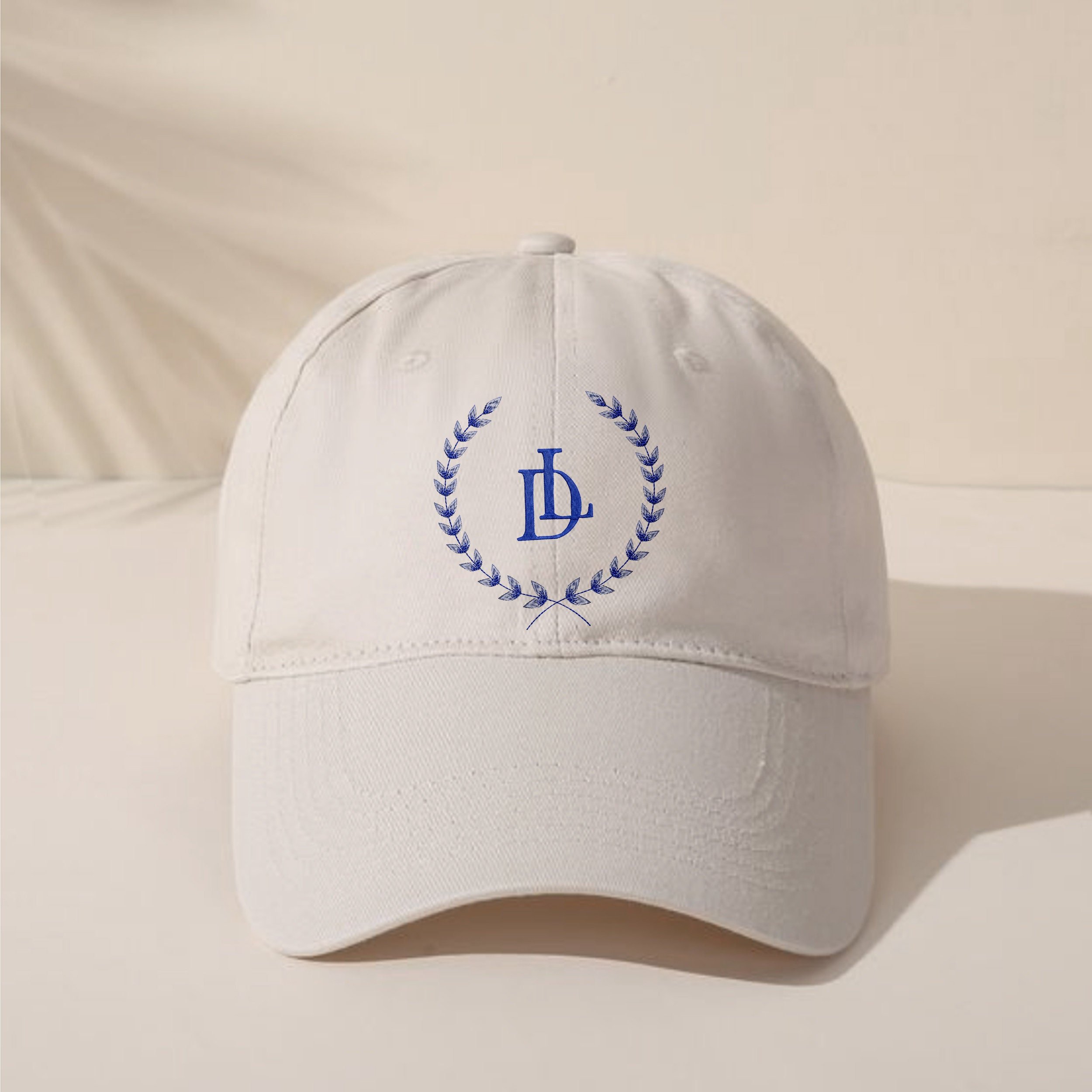 Monogram Wedding Blue and White Crest Wreath and Border Machine Embroidery Design embroidered on a hat
