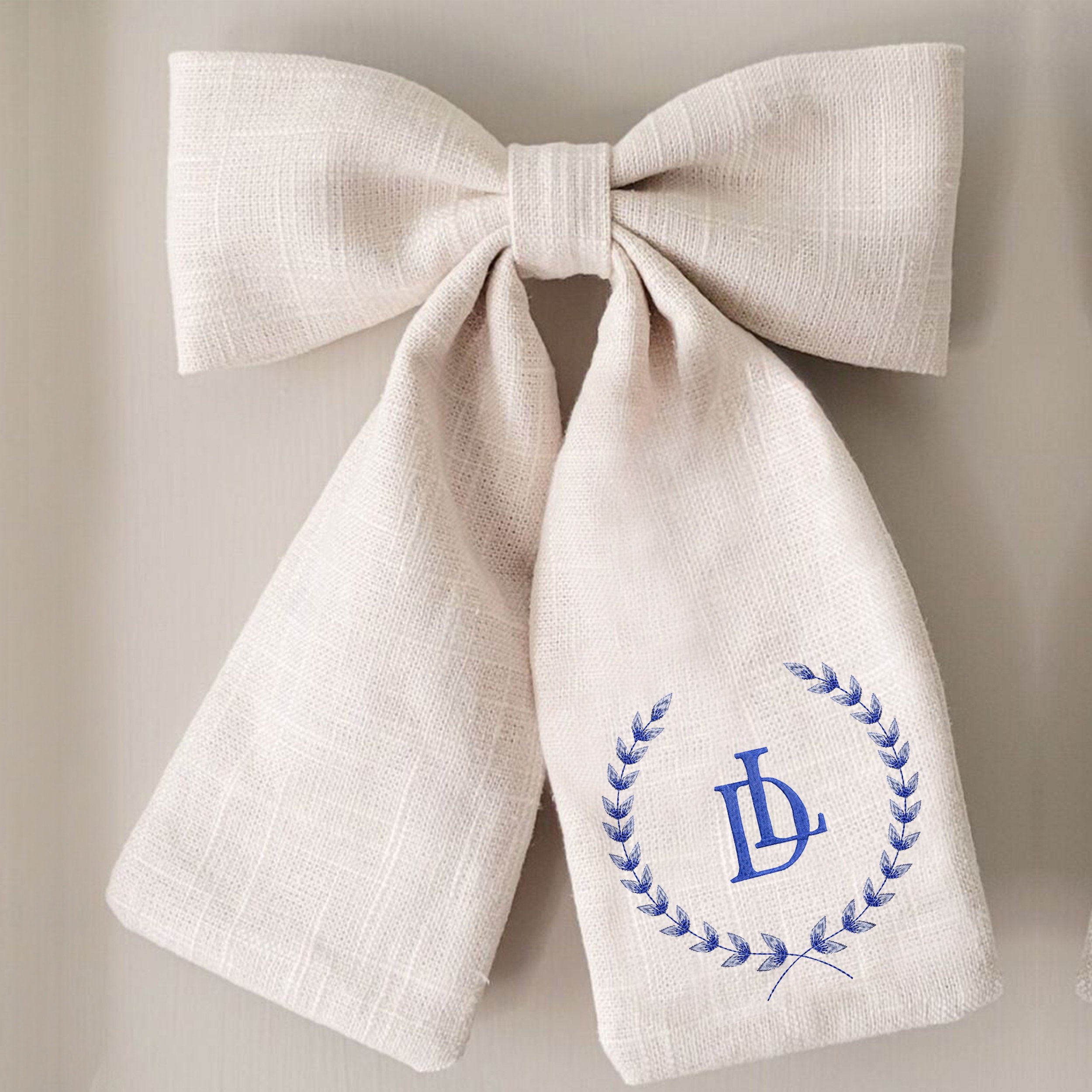 Monogram Wedding Blue and White Crest Wreath and Border Machine Embroidery Design embroidered on a bow