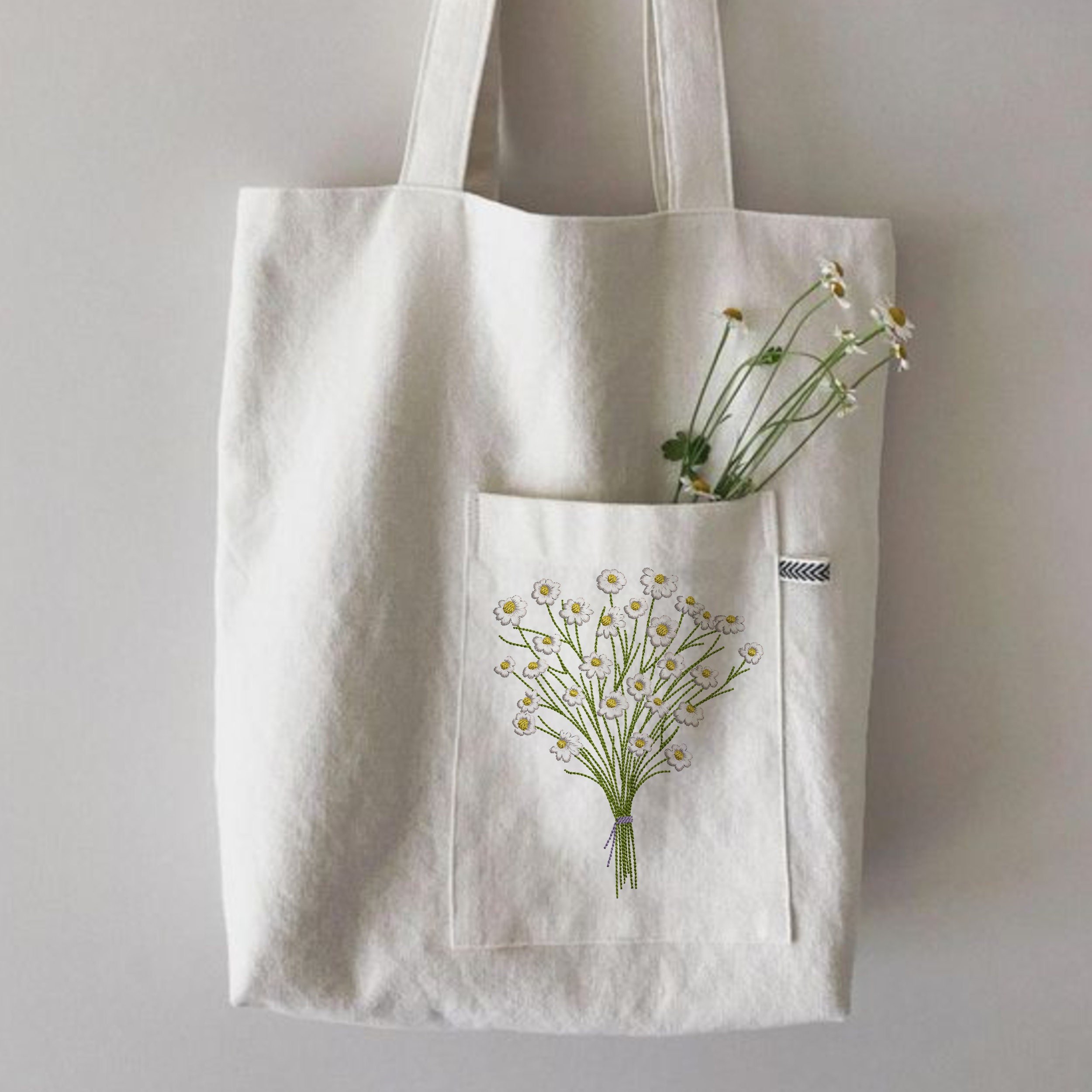 Chamomile Flower Bouquet Machine Embroidery Design File embroidered on a handbag