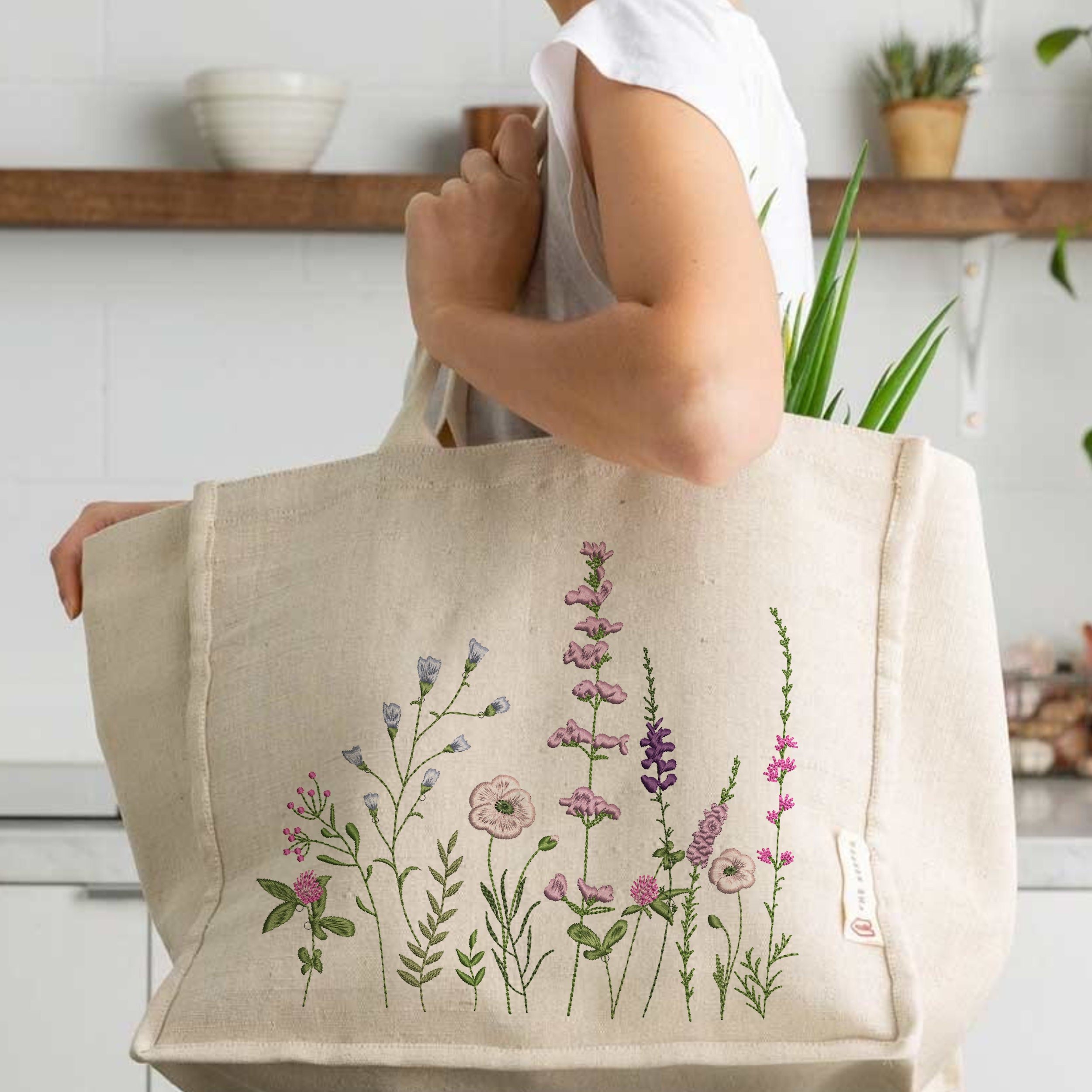 Sweet Meadow Machine Embroidery Design File embroidered on a handbag
