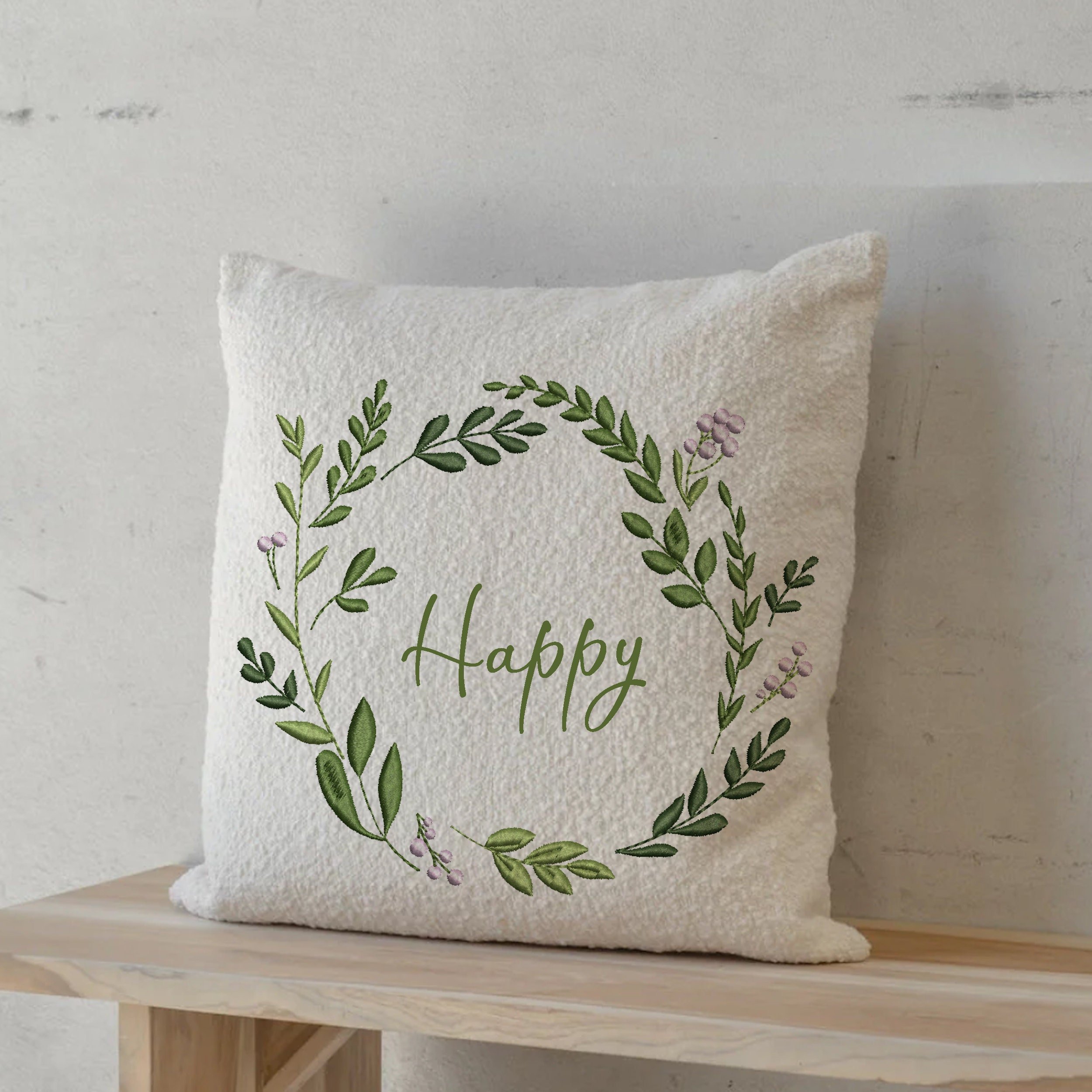 Happy Wreath and Border Machine Embroidery Design embroidered on a pillow