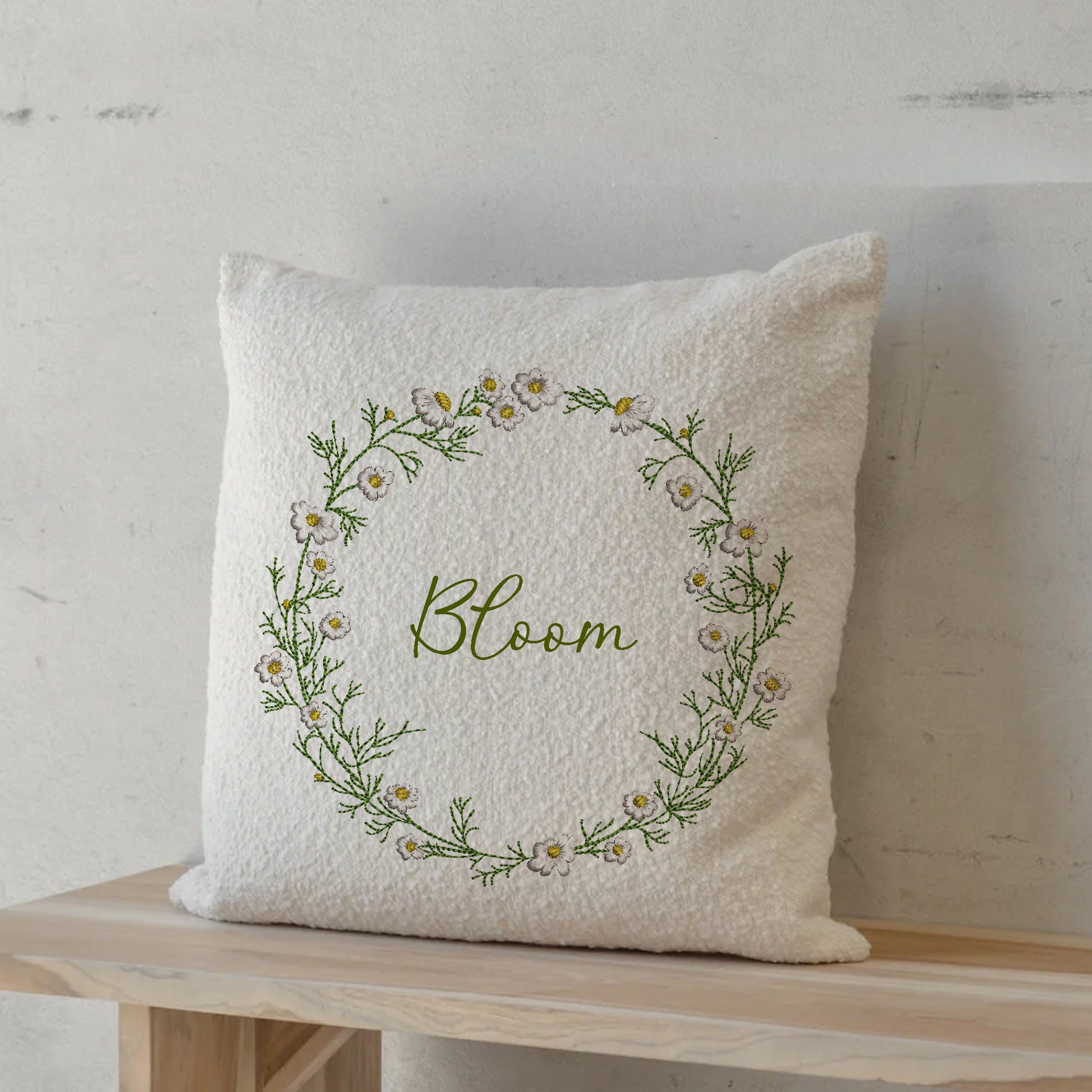 Chamomile Wreath and Border Machine Embroidery Design Bundle embroidered on a pillow