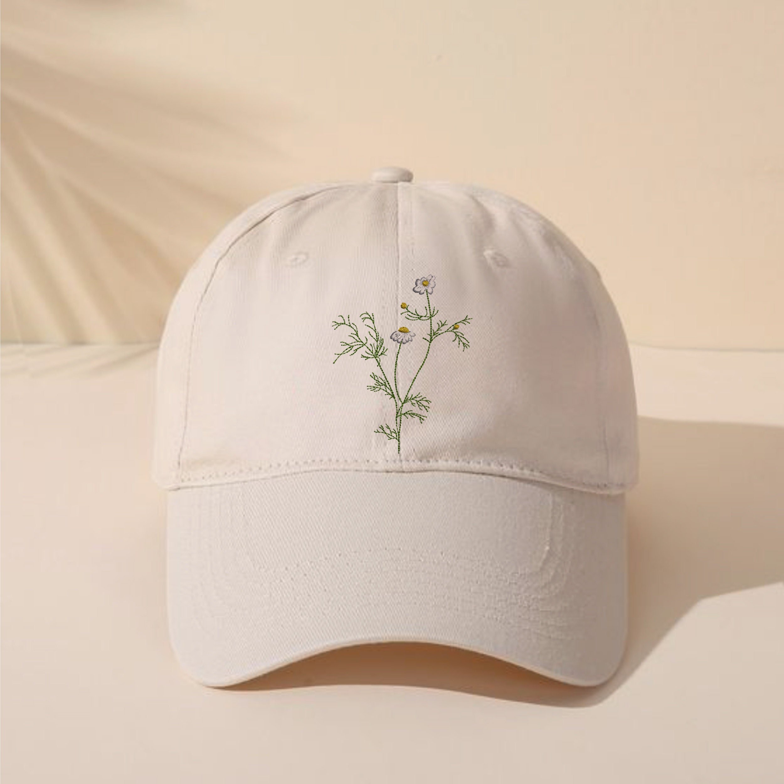 Chamomile Wreath and Border Machine Embroidery Design Bundle embroidered on a hat