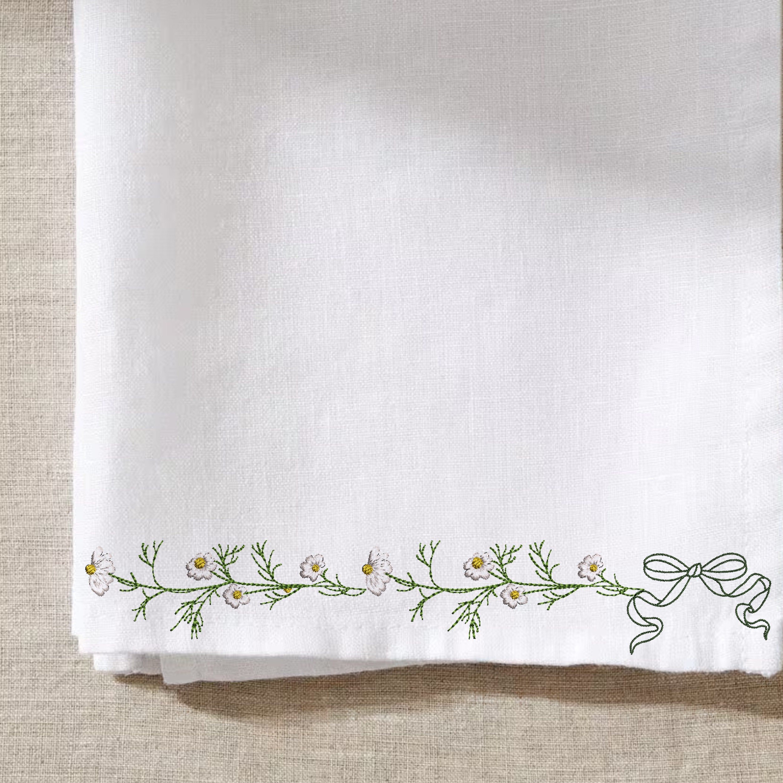 Chamomile Wreath and Border Machine Embroidery Design Bundle embroidered on a kitchen towel border