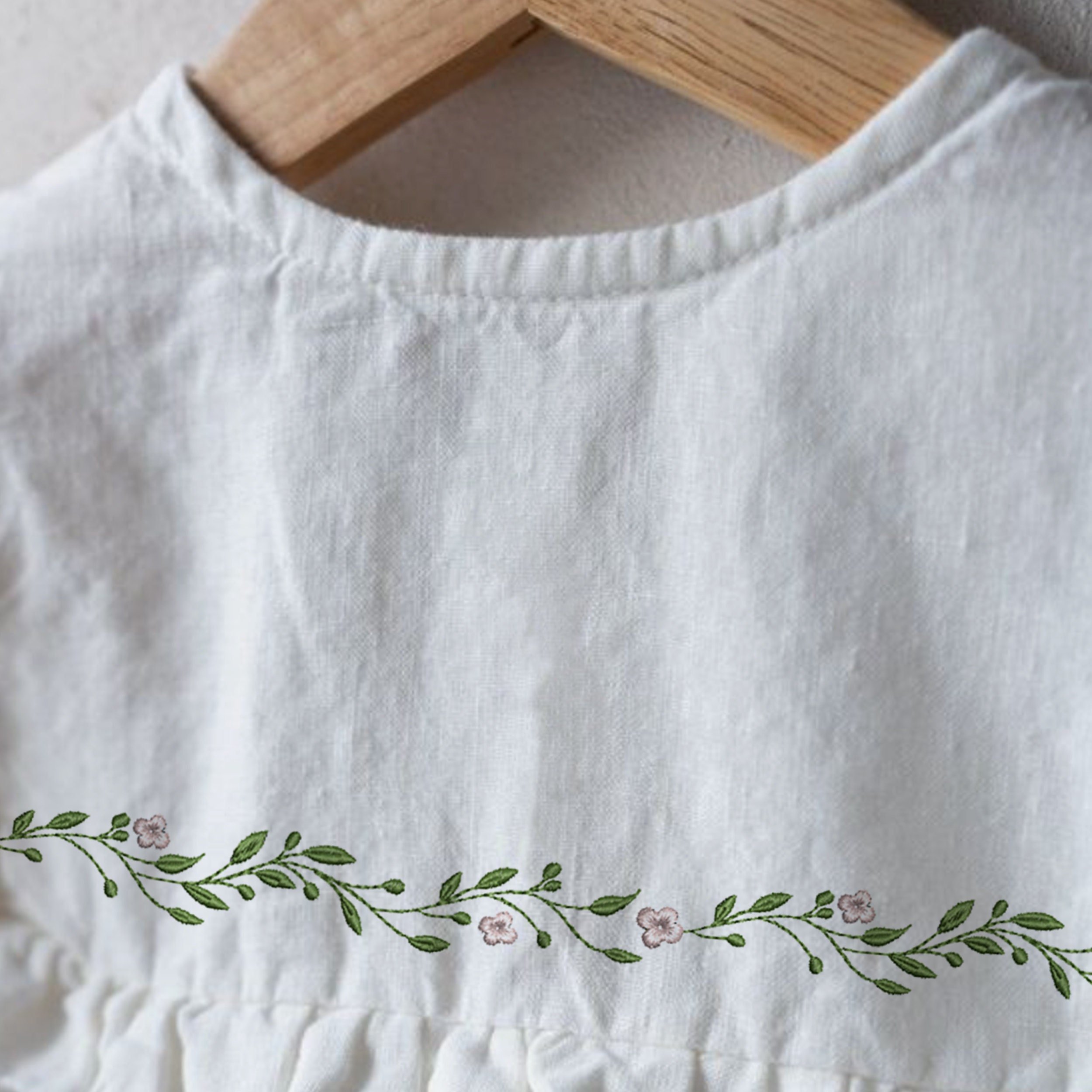 Favorite Floral Wreath and Border Machine Embroidery Design Pattern embroidered on a white blouse
