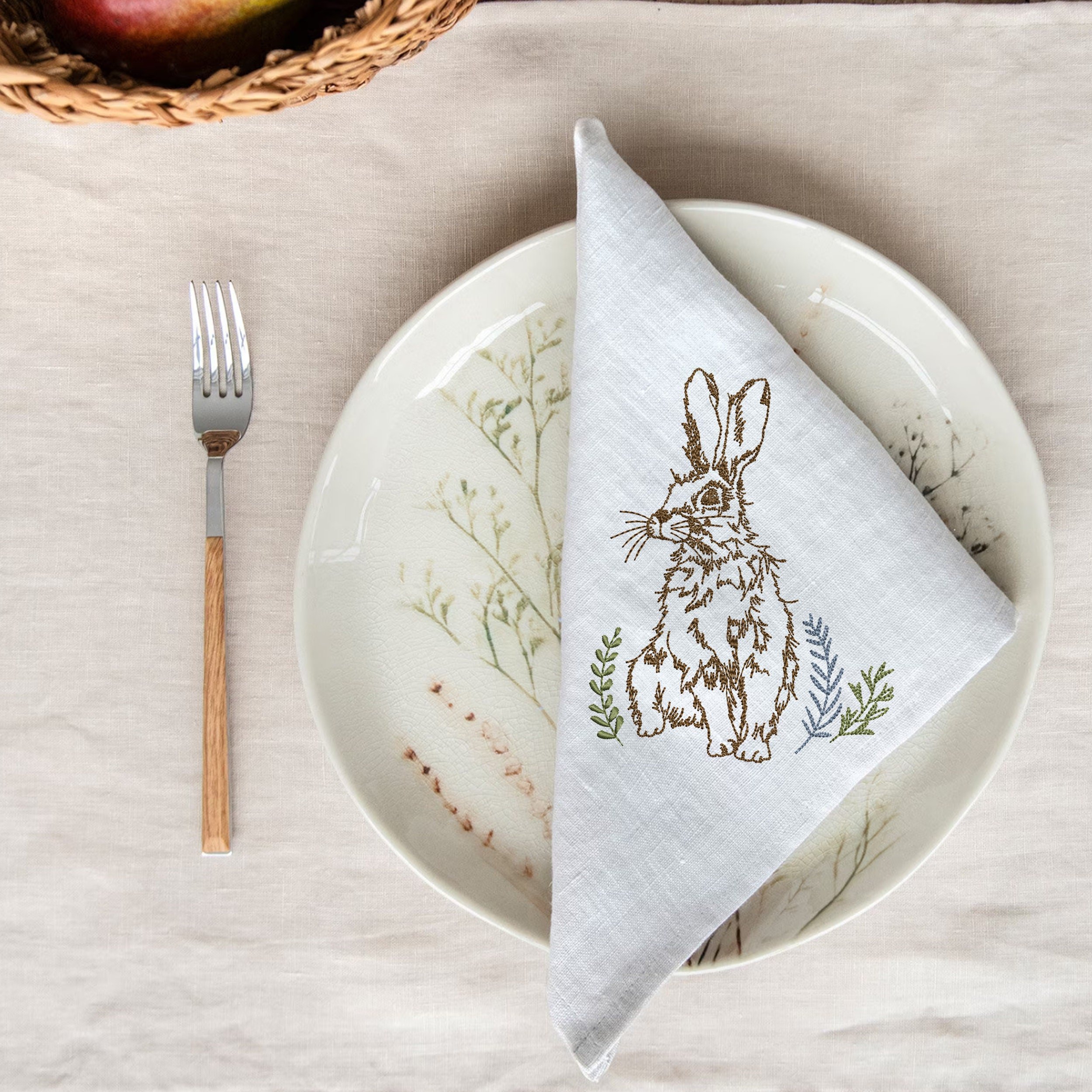 Moon Garden Hare Machine Embroidery Design File embroidered on a napkin