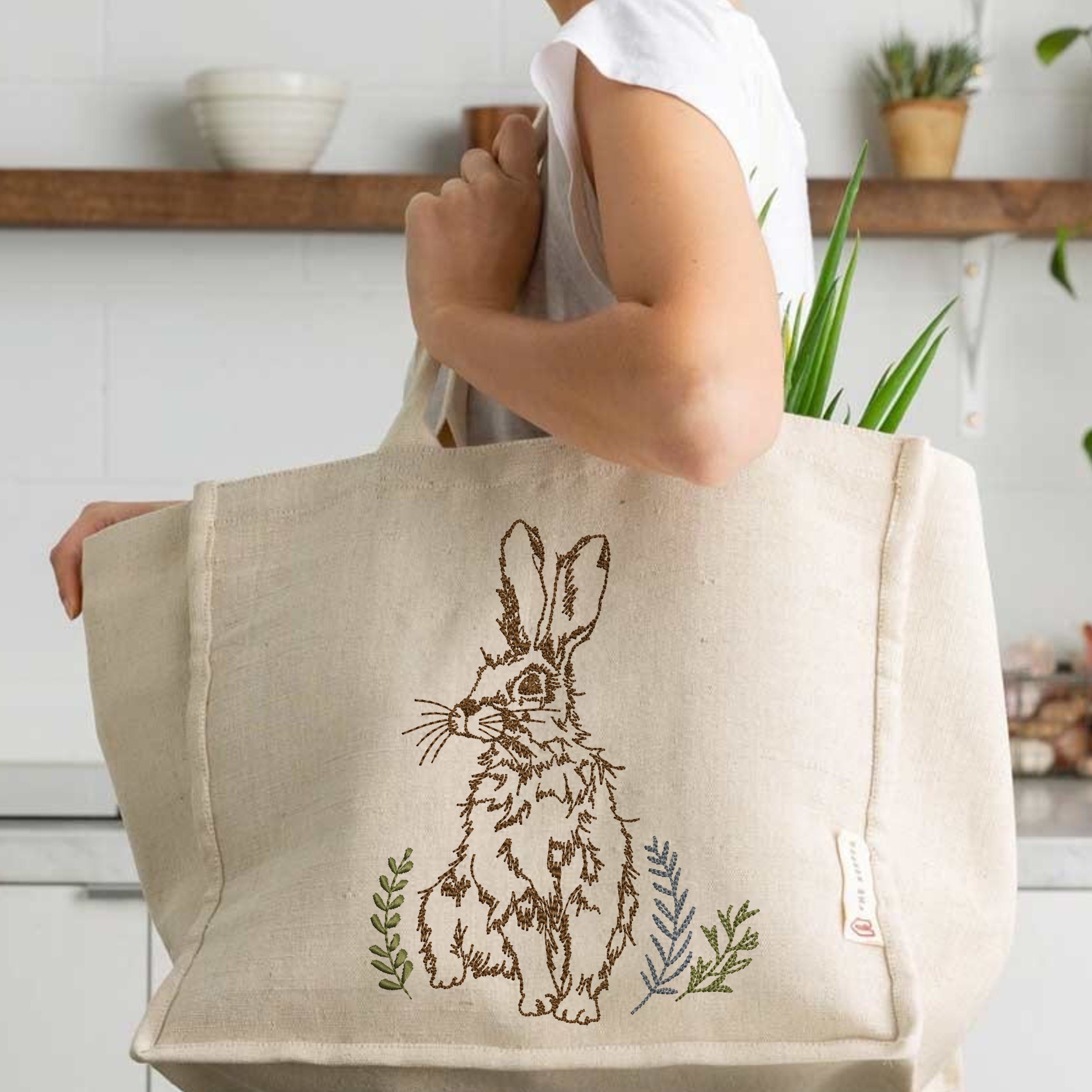 Moon Garden Hare Machine Embroidery Design File embroidered on a handbag