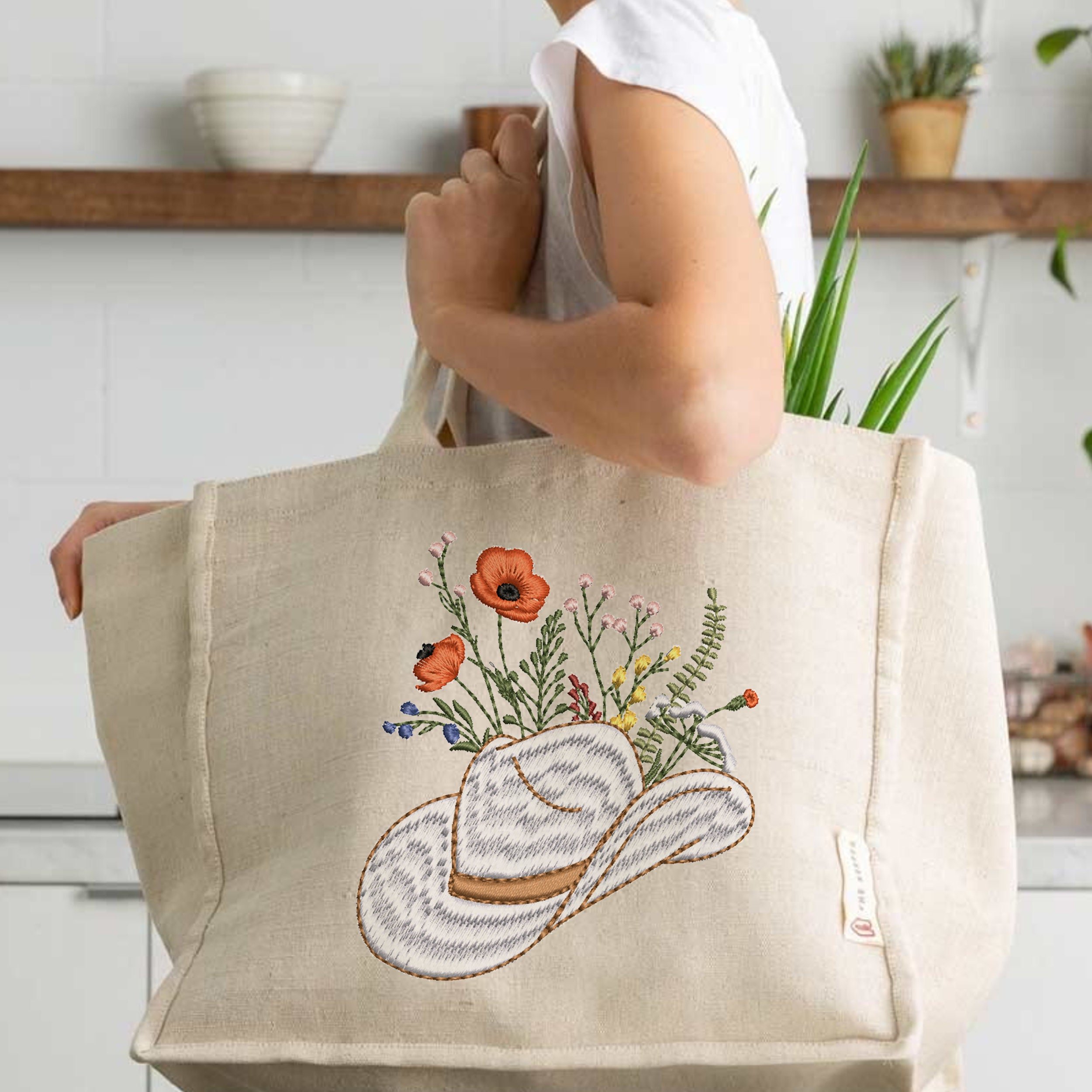 Cowgirl Wildflower Hat Machine Embroidery Design embroidered on a shopping bag
