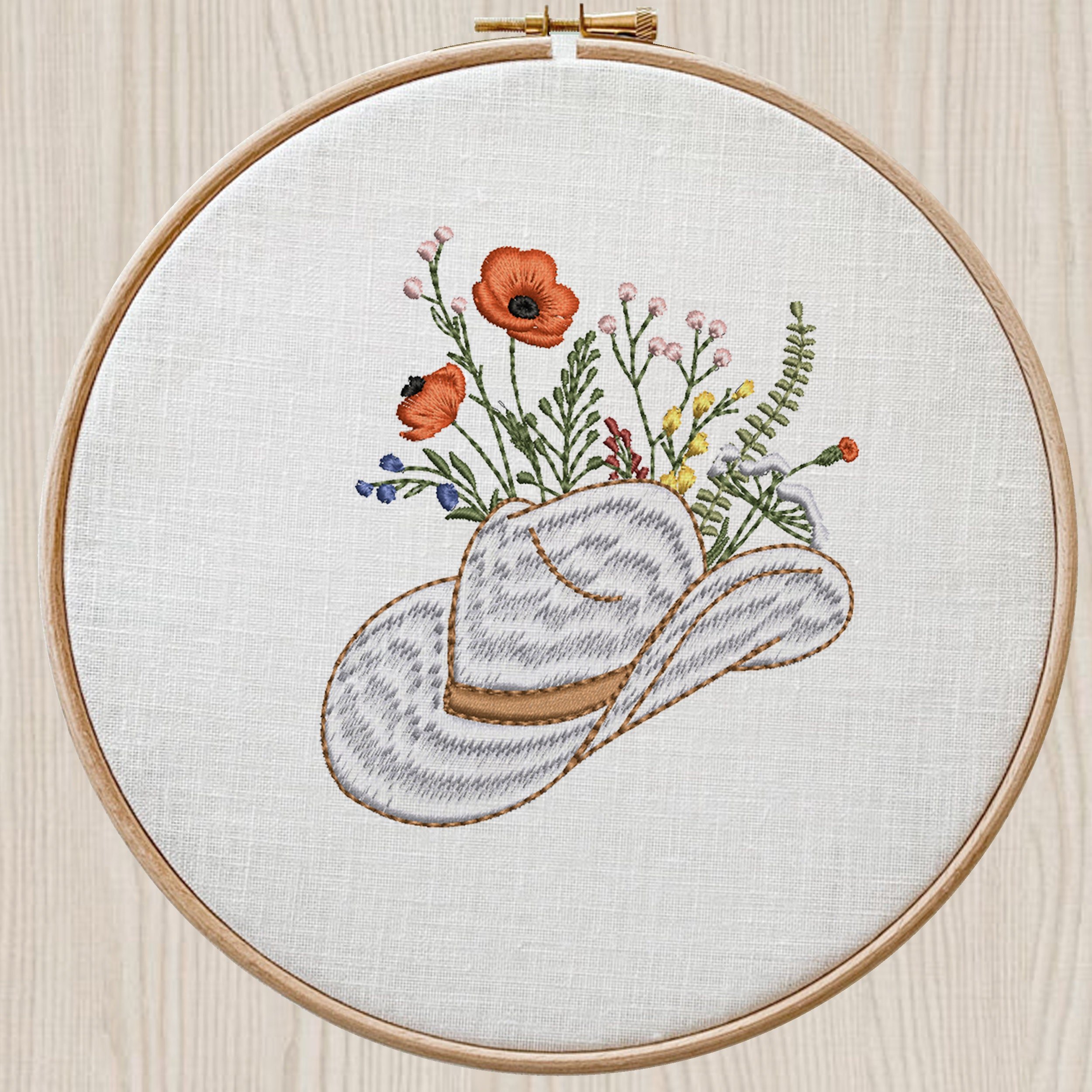 Cowgirl Wildflower Hat Machine Embroidery Design embroidered on a hoop