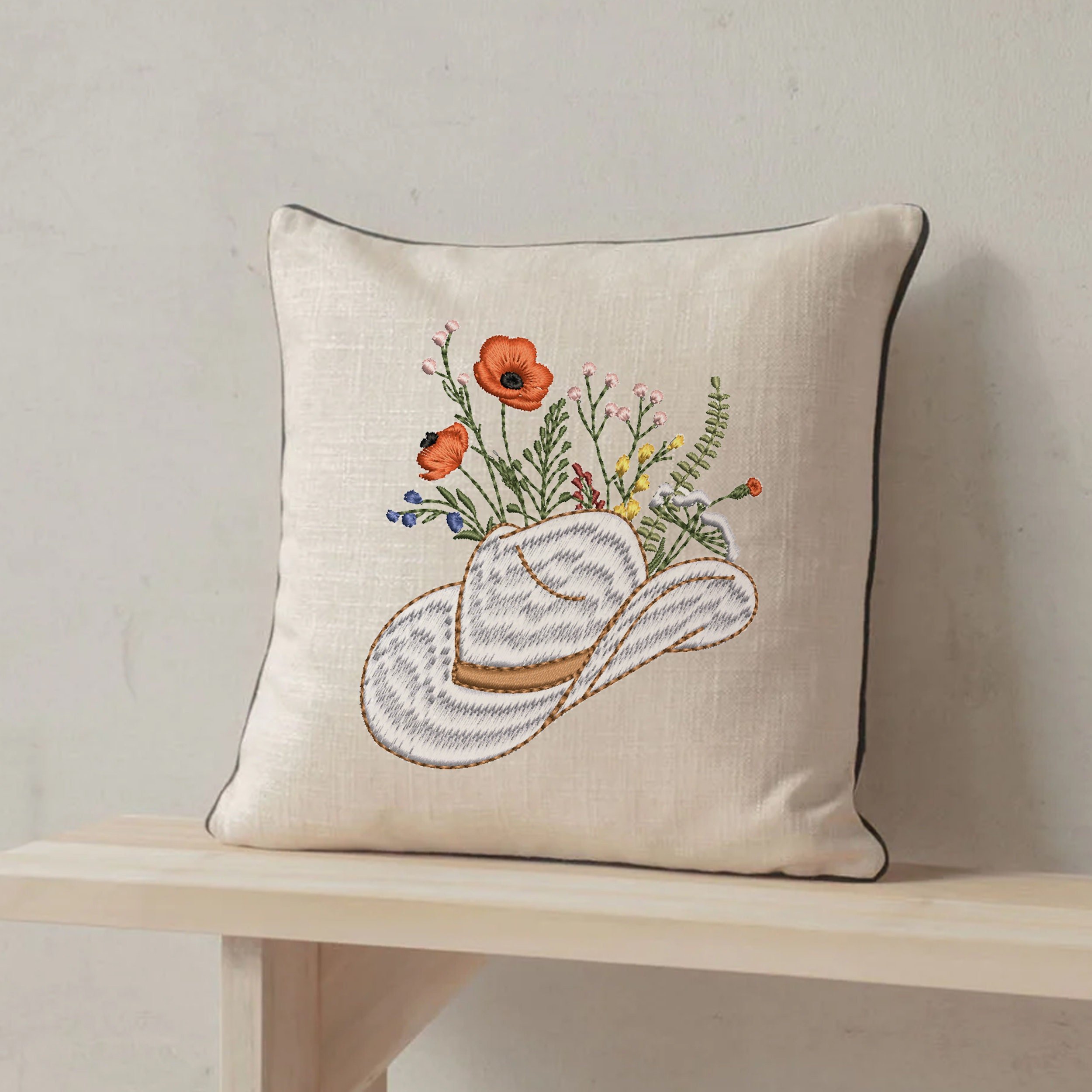 Cowgirl Wildflower Hat Machine Embroidery Design embroidered on a pillow