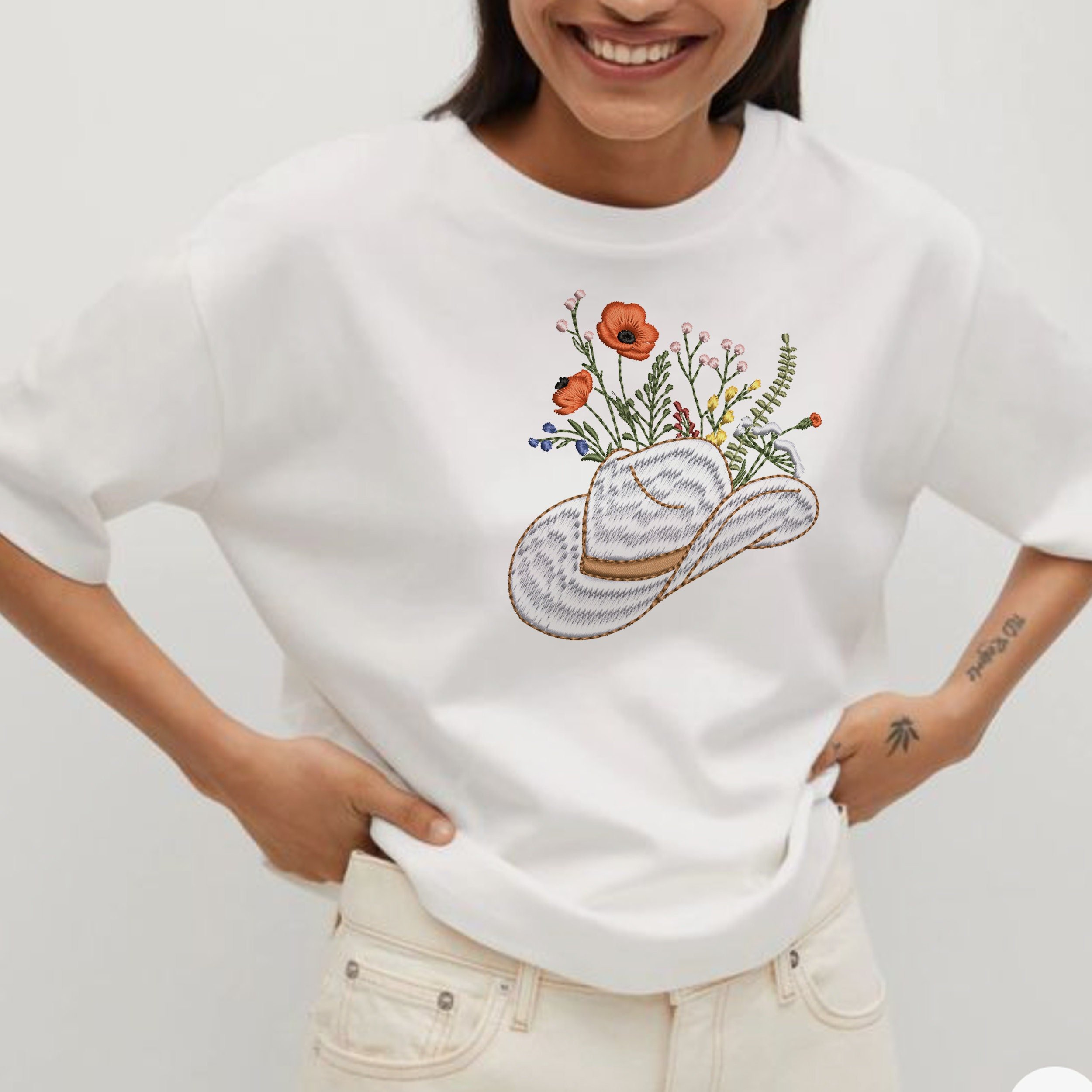 Cowgirl Wildflower Hat Machine Embroidery Design embroidered on a white t-shirt