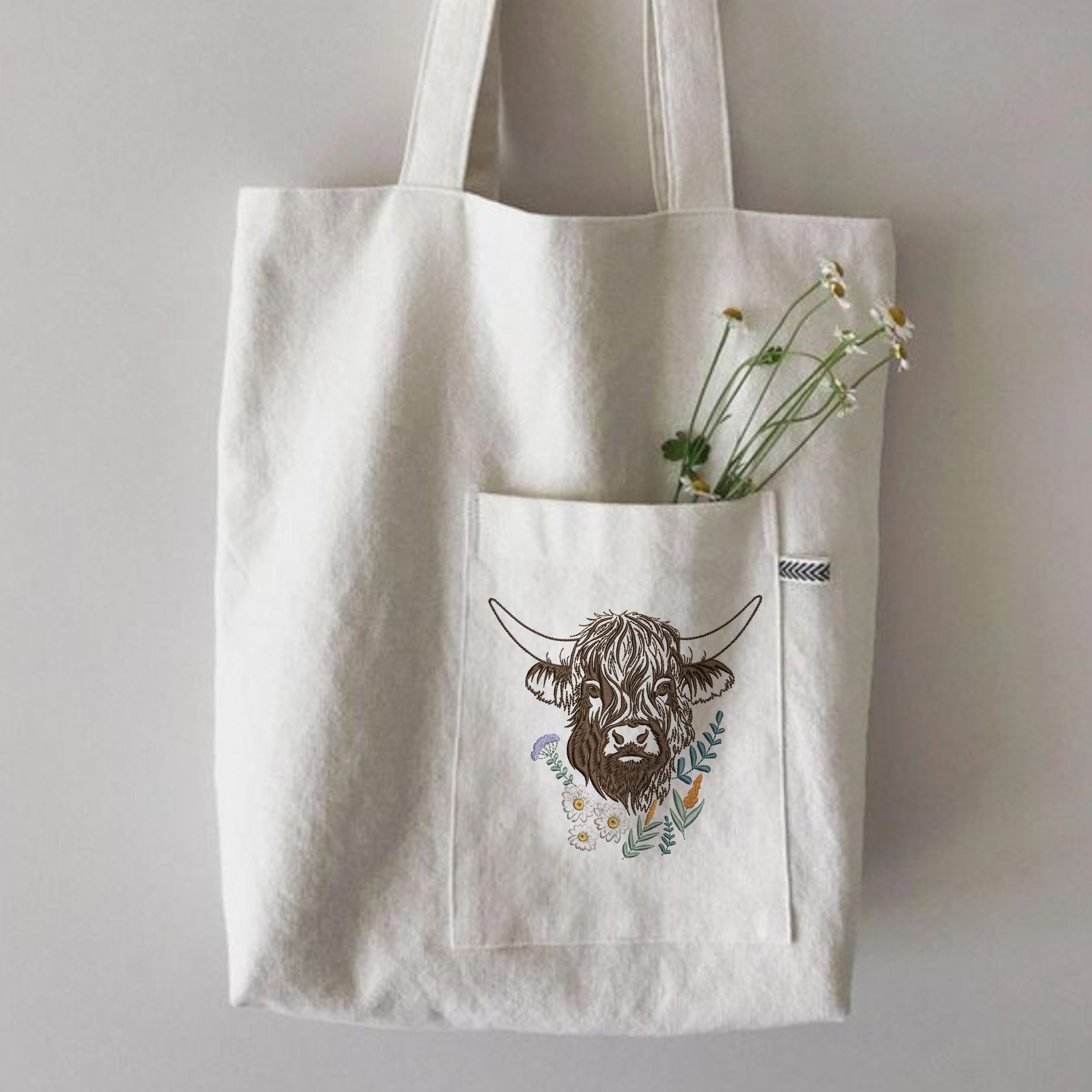 Highland Scottish Cow and Chamomiles Machine Embroidery Design File embroidered on a canvas bag