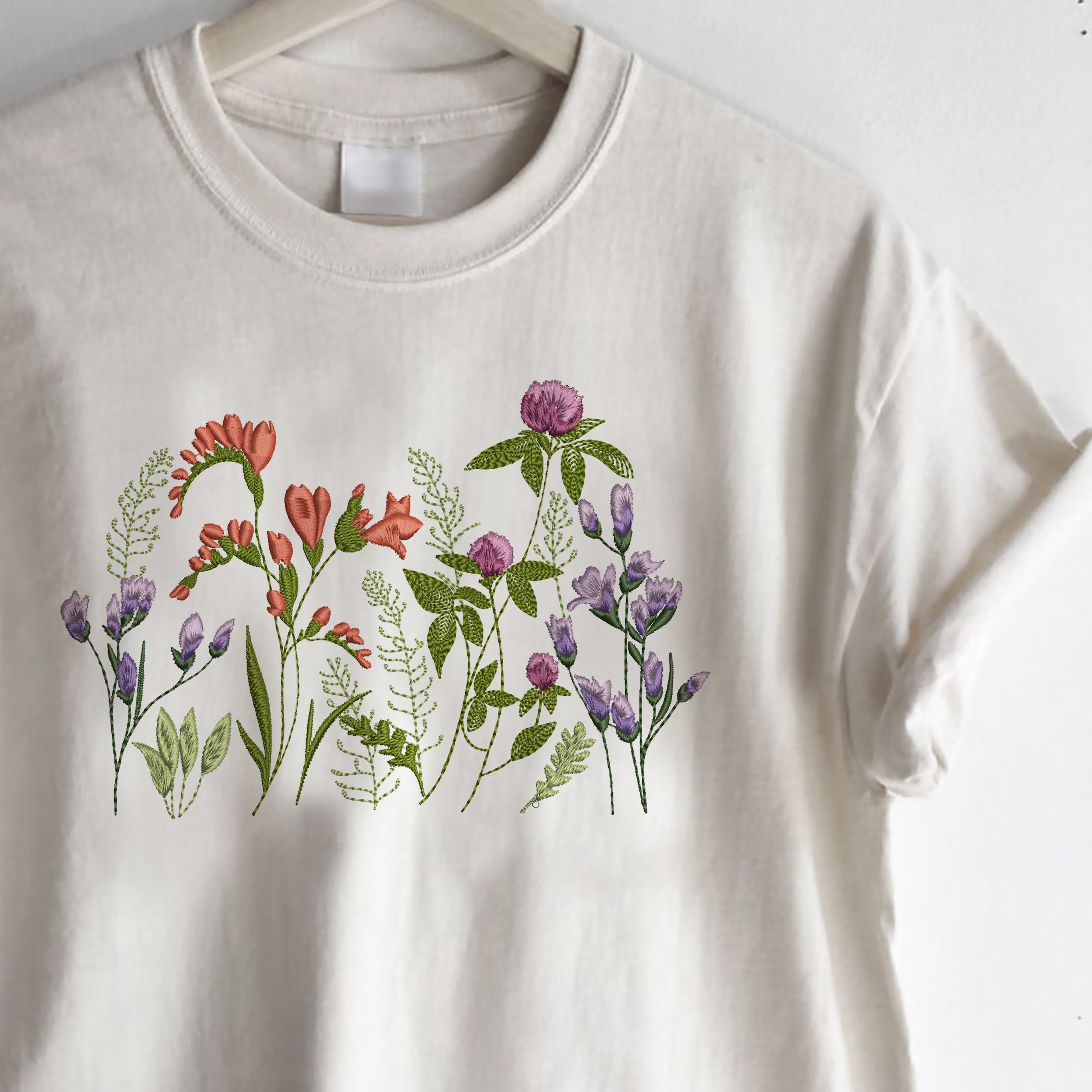 Clover and Freesia Garden Machine Embroidery Design zip file embroidered on a t-shirt