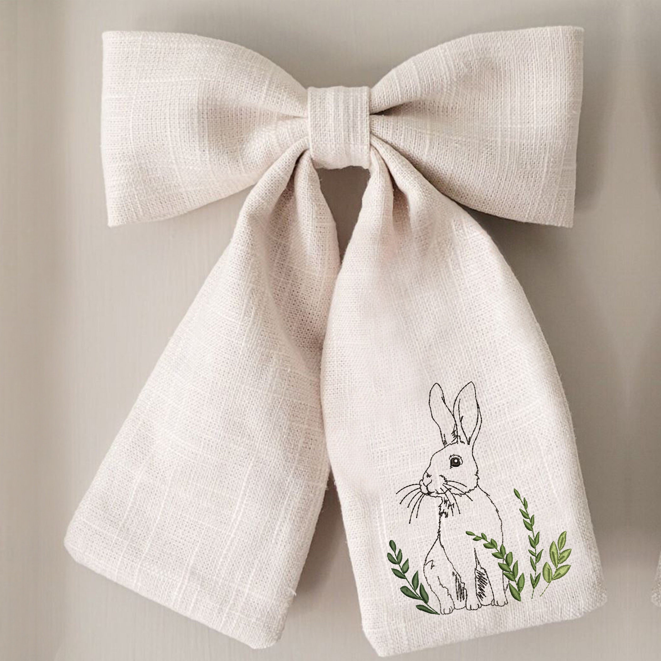 Meadow Hare Machine Embroidery Design File embroidered on a bow