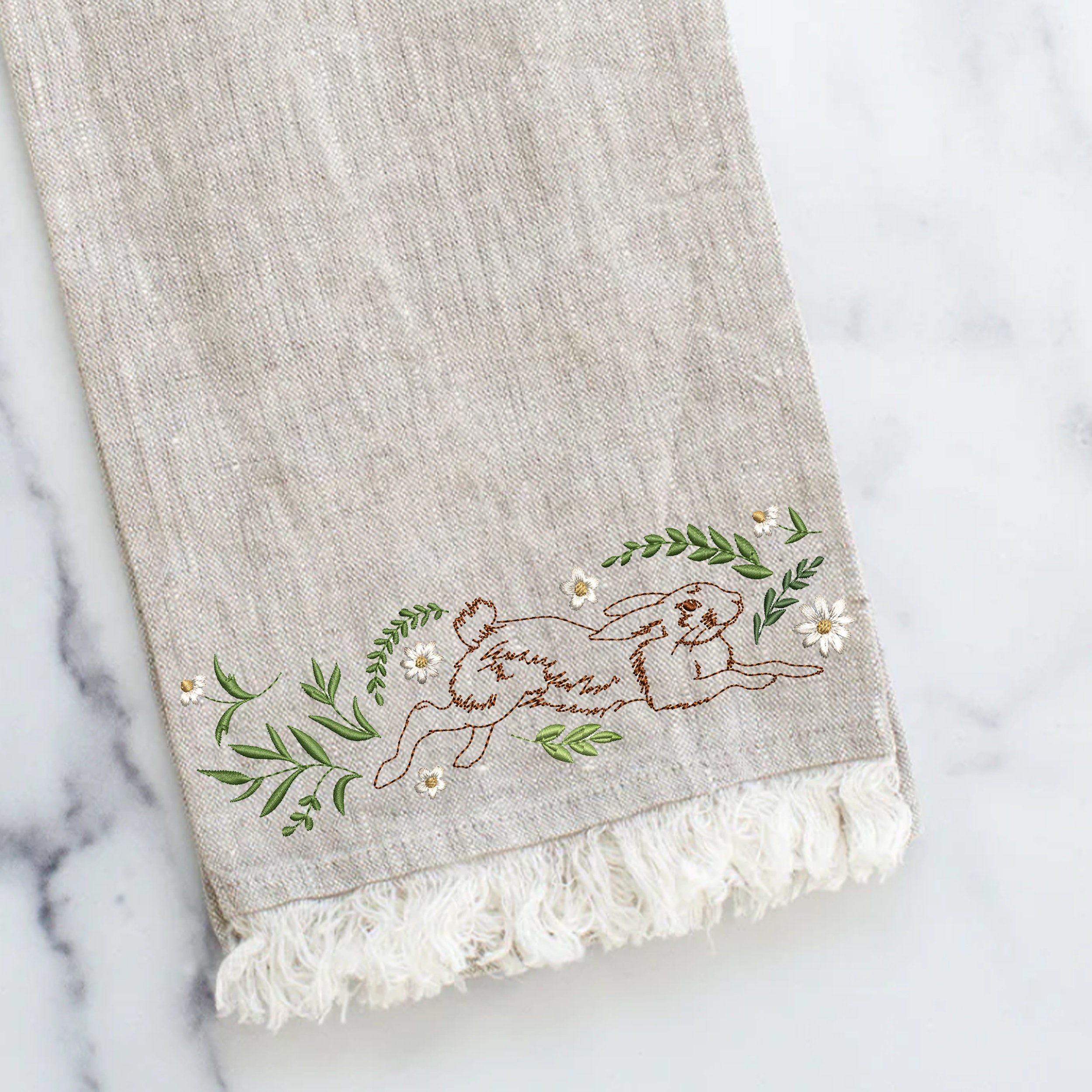 Floral Easter Bunny Border Machine Embroidery Design File embroidered on a linen towel