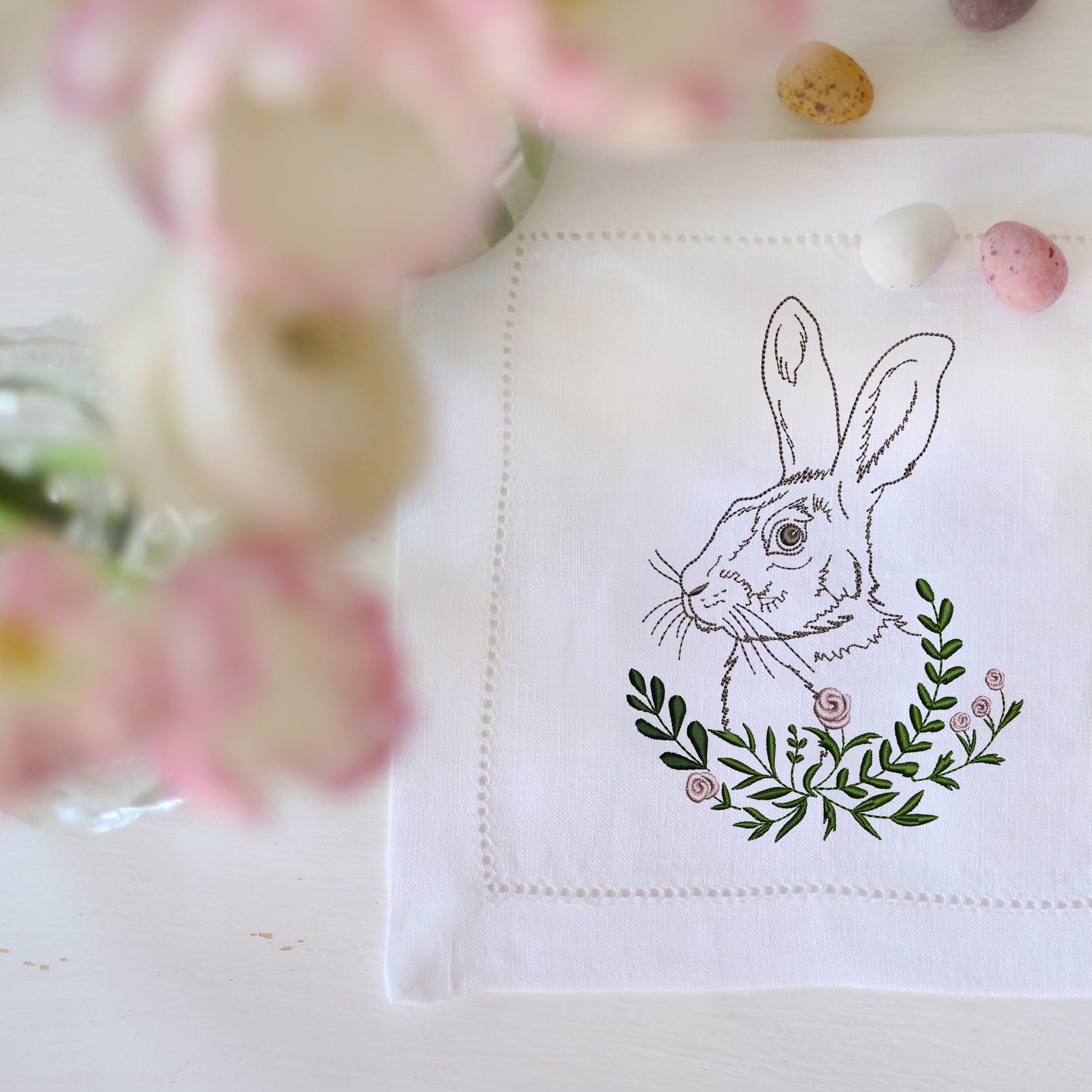 Garden Hare Machine Embroidery Design File embroidered on a napkin
