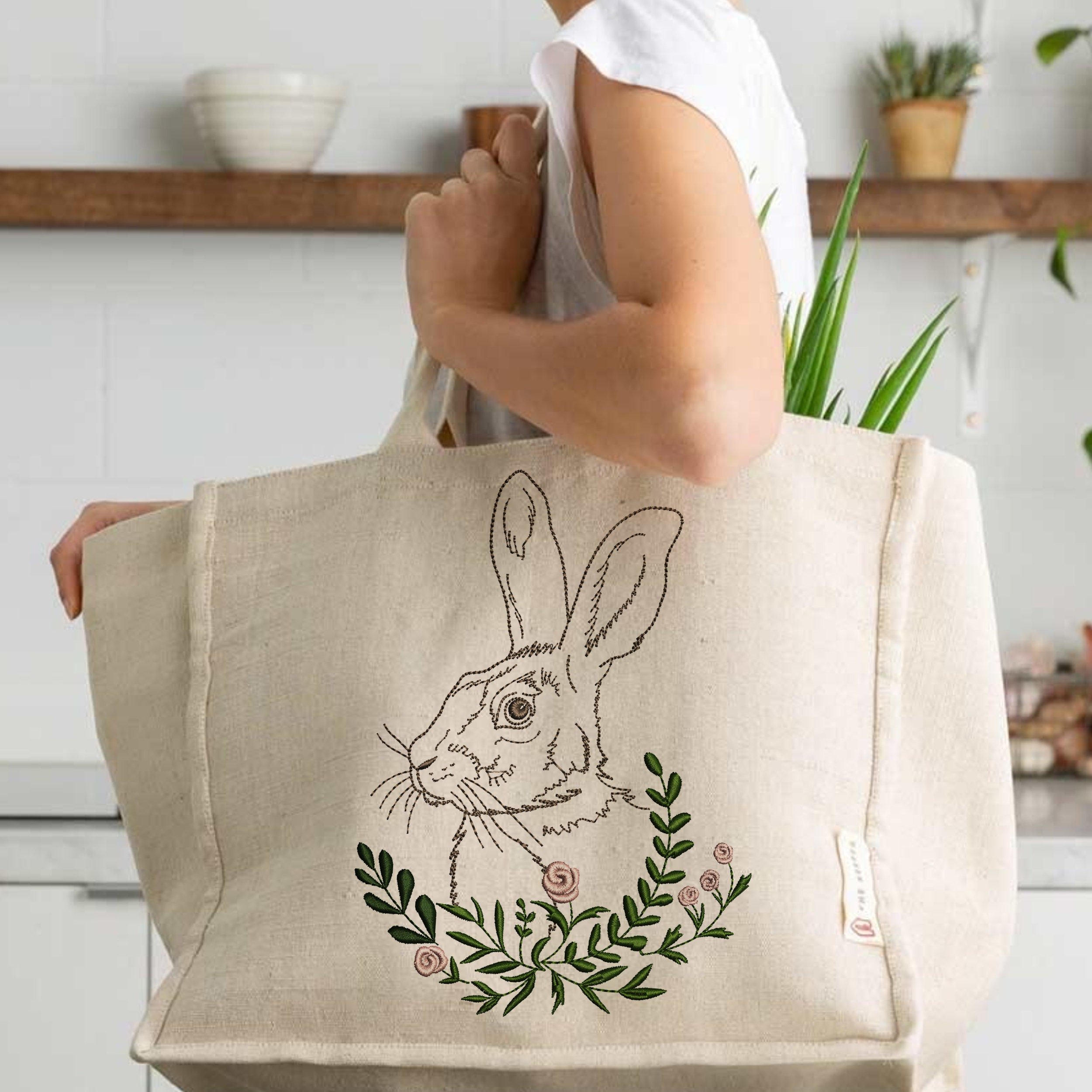 Garden Hare Machine Embroidery Design File embroidered on a handbag