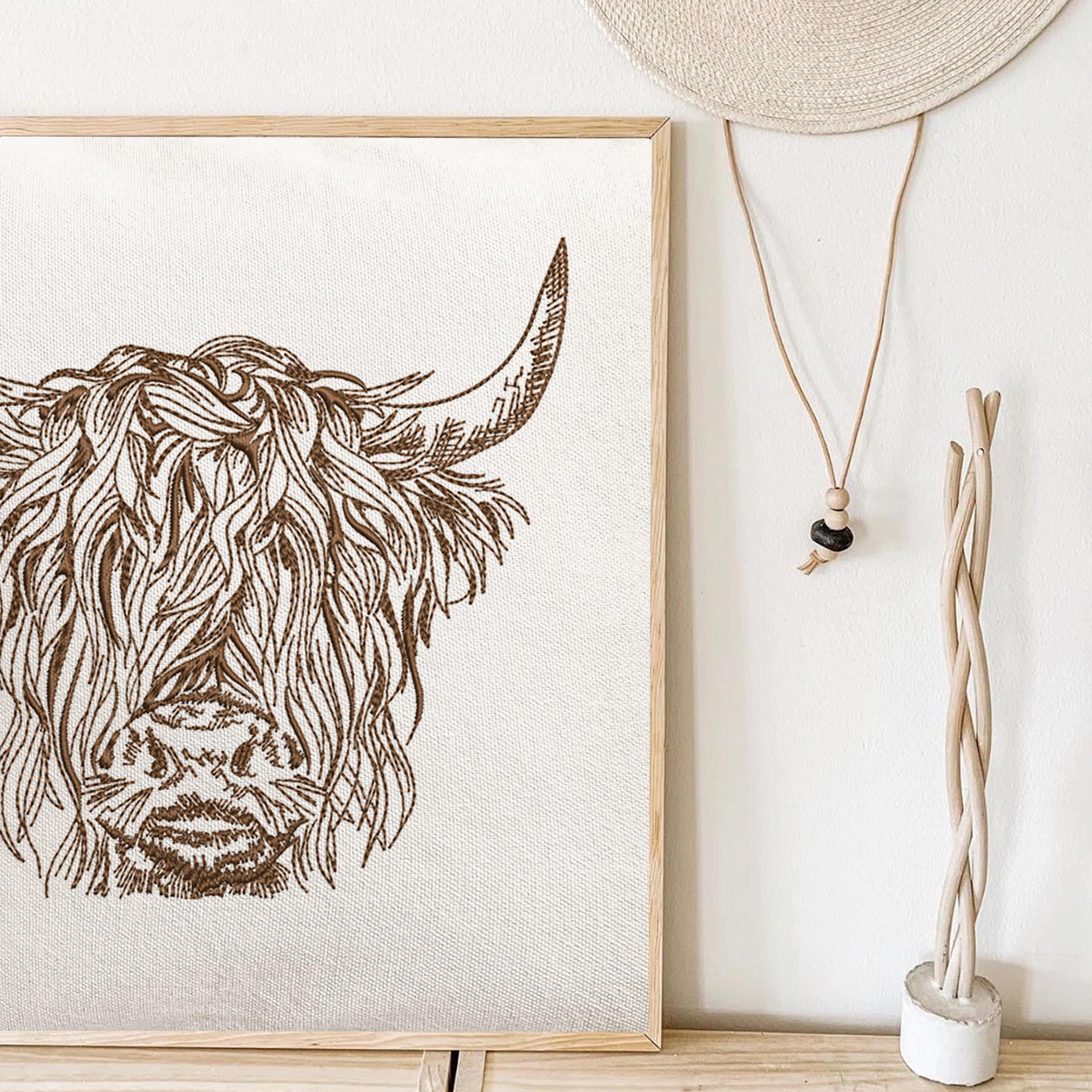 Scottish Highland Cow for Machine Embroidery embroidered on a canvas