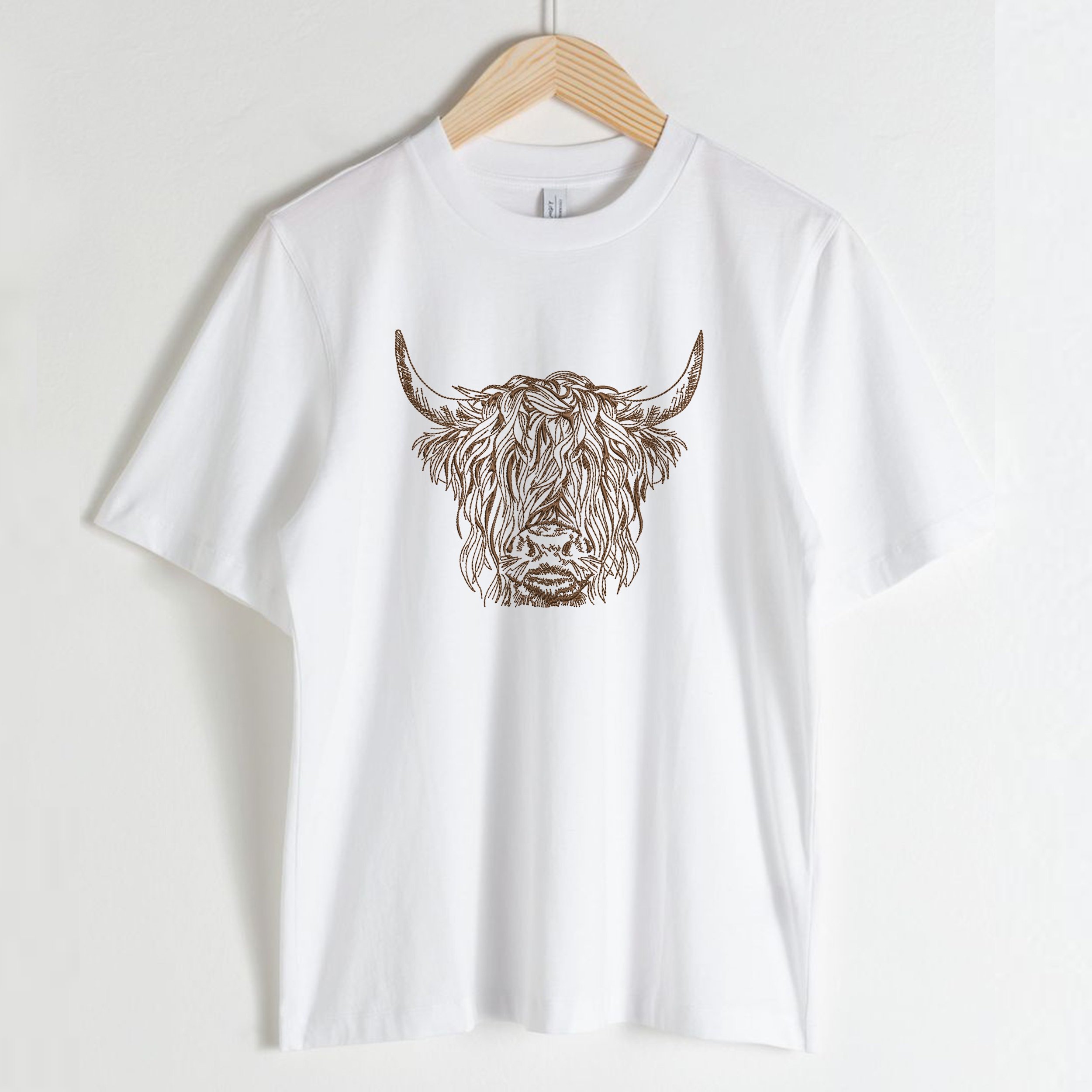 Scottish Highland Cow for Machine Embroidery embroidered on a t-shirt
