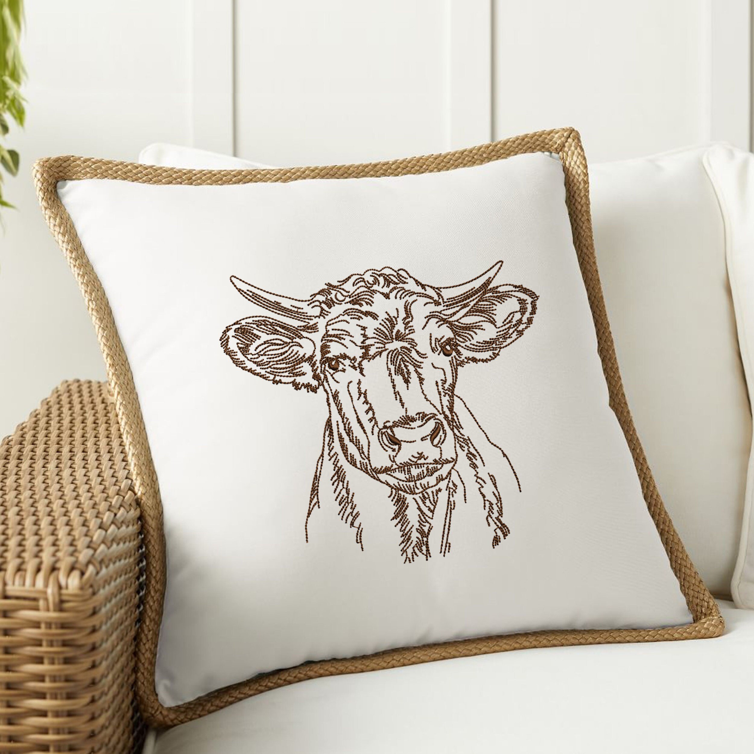 Meadow Cow Machine Embroidery Design embroidered on a pillow