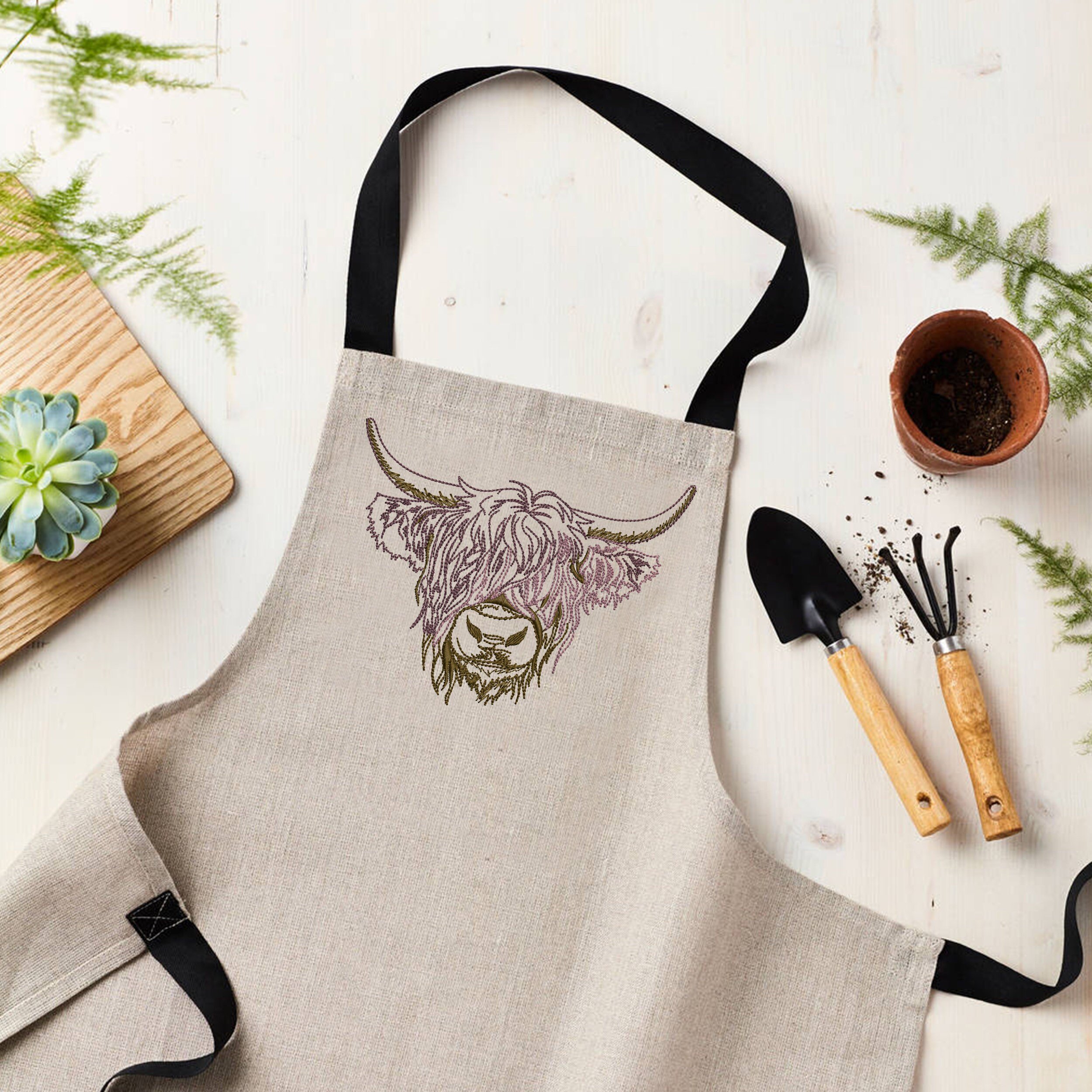 Scottish Highland Cow Machine Embroidery Design ZIP File embroidered on a apron