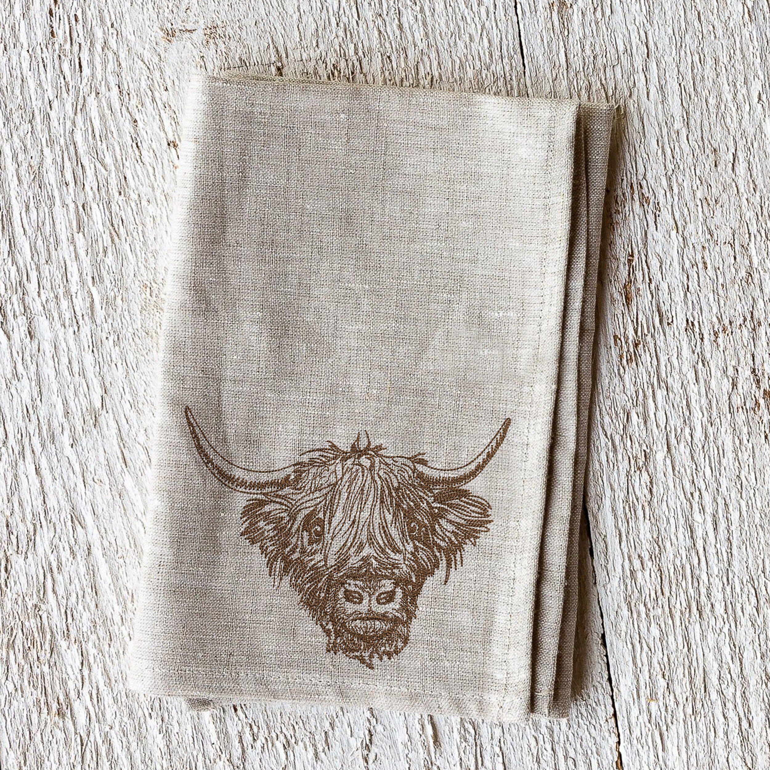 Scottish Highland Cow for Machine Embroidery embroidered on a napkin