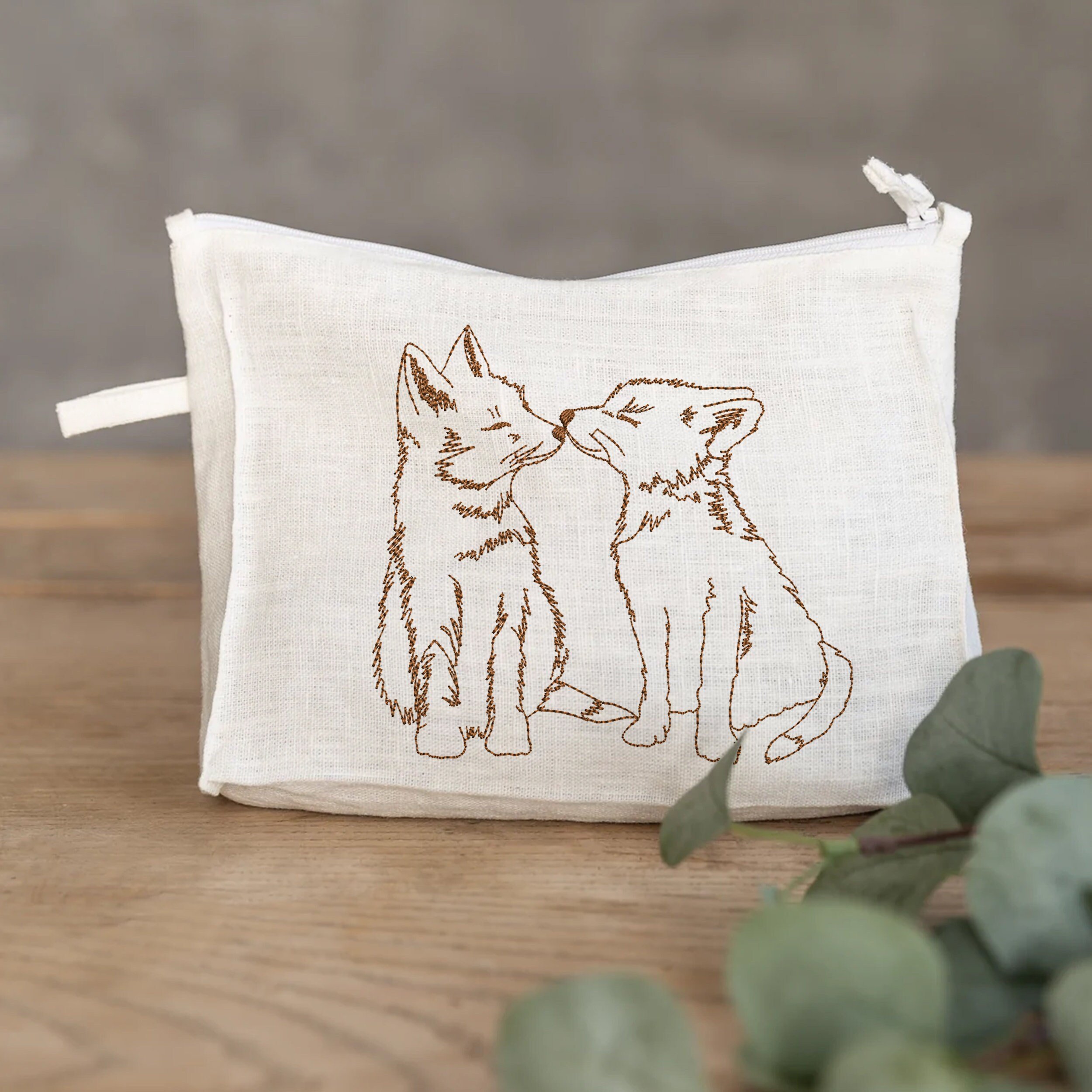 Adorable Foxes Machine Embroidery Design embroidered on a pouch
