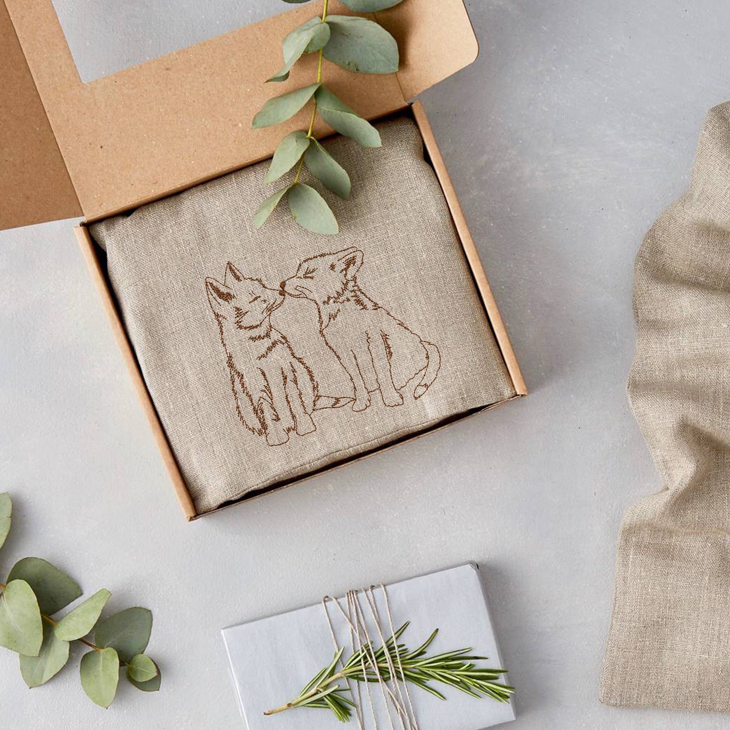 Adorable Foxes Machine Embroidery Design embroidered on a gift box